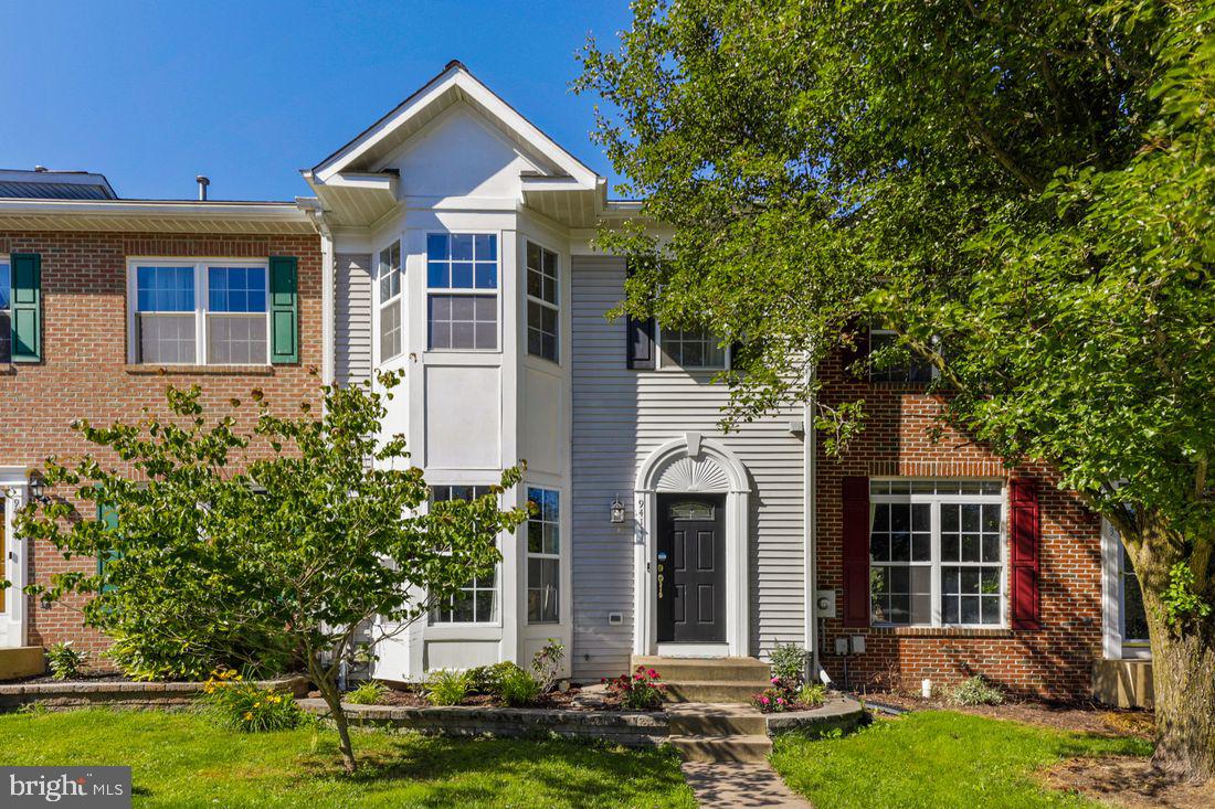 Welcome home to this 3 BR, 3 full & 1 1/2 BA townhome which features a possible 4th bedroom with a FULL walkout in the beautifully finished above-grade lower level. This home also uniquely boasts an extended bump out on all 3 levels, fresh paint, upgraded hand-scrapped, wide plank engendered wood floors on the first and and second floor, updated kitchen floor, stainless appliances, replaced roof, updated HVAC, and renovated MA bath w oversized shower. Enjoy evenings on the deck backing to private woods. Community amenities include pools, jogging trails, tennis courts & shopping. No city taxes.
