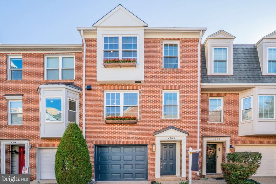 Welcome home to 1205 Madison Street, a stunning, completely renovated three-level brick townhouse in sought-after Braddock Place!
Just down the street from Braddock Road Metro Station, this fabulous home puts you minutes from everything Old Town has to offer. Walk, skip, stroll or hop to local favorites like Dos Amigos (because Taco Tuesday just got better!), grab your morning coffee on the go, or bike to the heart of King Street within minutes. 
Offering almost 2,000 sun-drenched square feet, this home features two primary bedrooms with en-suites and a half bath on the main level that gives serious zen vibes. Engineered wide-plank hardwood floors flow throughout, setting the tone for warm, modern elegance.
Enjoy cooking in the beautifully redesigned kitchen boasting GE Café appliances, sleek modern cabinetry, a built-in dry bar, and quartz countertops making this a showpiece for both cooking and conversation. The pass-through window to the dining and living rooms keeps the space open and social, perfect for hosting dinner parties or quiet nights in. 
On the entry level, a cozy family room with fireplace opens to the private fenced-in patio, extending your living space outdoors. Imagine sipping a glass of wine under the stars.
Upstairs,the top level features two spacious bedrooms, each with en-suite baths and wall-to-wall closets, offering comfort and privacy for everyone.
Every detail has been thoughtfully designed, even the lighting! All recessed lights feature dual modes: regular light and night light. Try it out by flicking the light switches on-off-on in quick succession to see the soft glow of the night mode.
Additional highlights include a one-car garage for off-street parking and a location that’s hard to beat! Less than a mile from Oronoco Bay Park on the waterfront. This home is walkable, bikeable, and a short drive to Old Town’s amenities, including Trader Joe’s, Harris Teeter, local restaurants, and boutique shopping.
Enjoy an easy commute with Braddock Metro Station with the Blue and Yellow Lines, and it’s  convenient to major commuter routes including GW Parkway, N. Washington Street, Route 1, King Street, plus a quick drive to I-395, DC, the airport, or the Pentagon.
Ready to call Old Town home? Schedule your tour today!