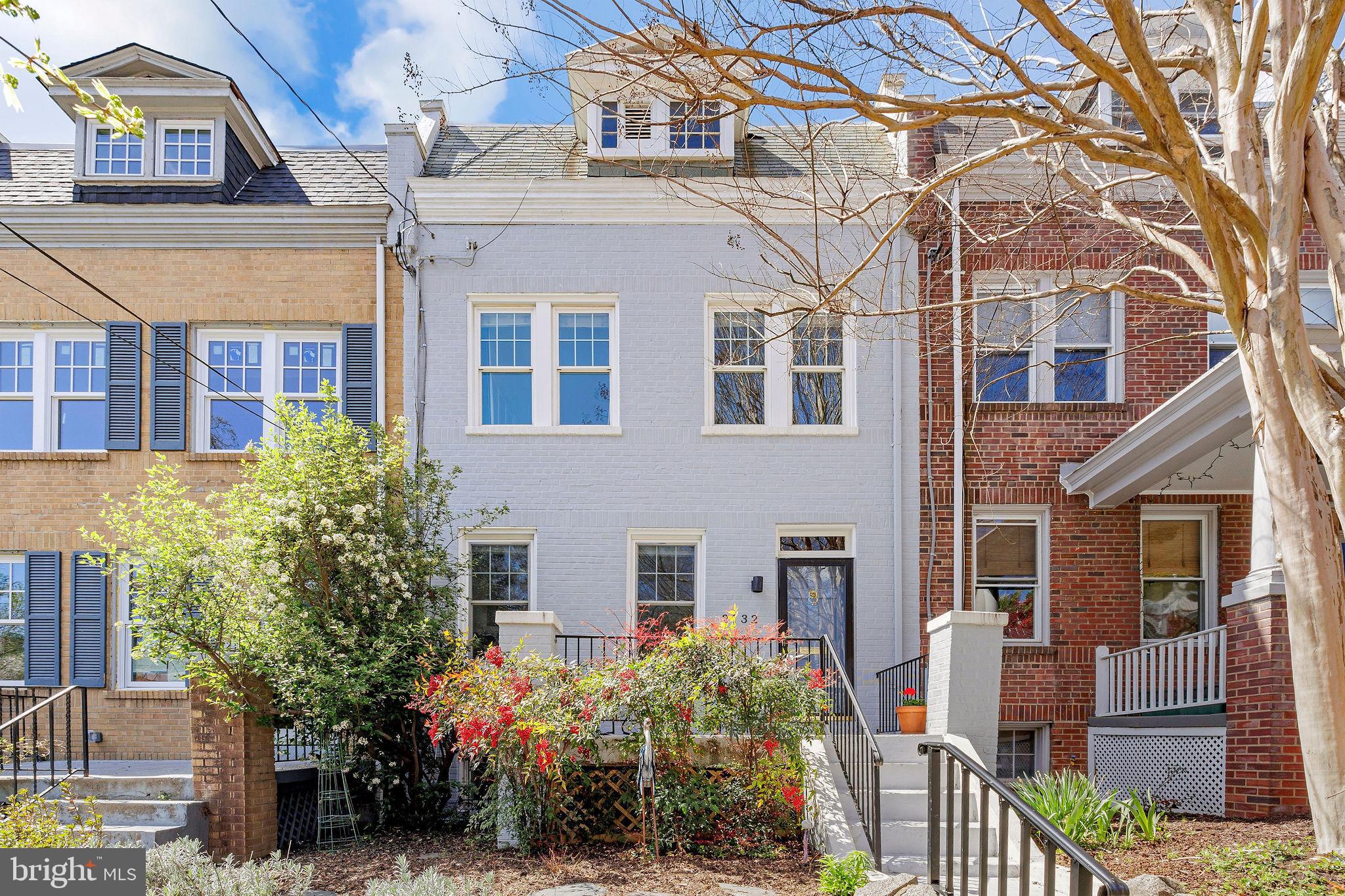 2-car parking in addition to front and rear terraces, 3 finished levels, 3 bedrooms, 2.5 total baths in this sunny, charming, wide townhouse with oak floors, original moldings, high ceilings, updated kitchen w/pantry, finished basement guest suite w/2nd kitchen and full bath, brick wood-burning fireplace, 2 skylights. Close to Trader Joe's, Whole Foods, Safeway, restaurants and playground by Stoddert School. 4/14 open 2-4 pm.