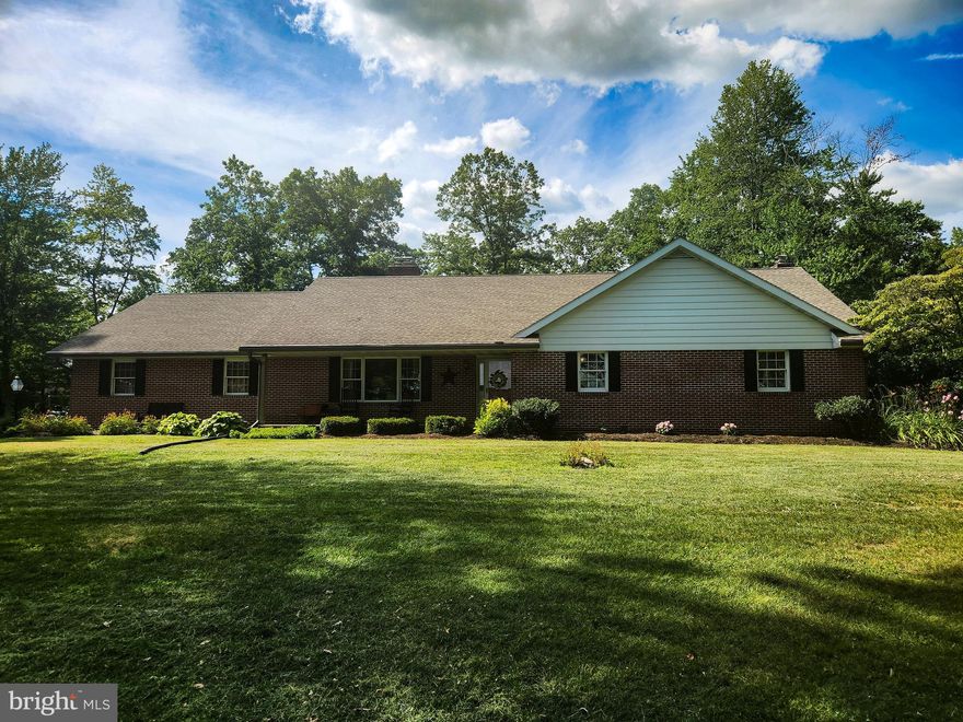 This property will be offered at Public Auction on Thursday, August 15, 2024 @ 6pm.  The listing price is the opening bid only and in no way reflects the final sale price.  10% down due at auction, 2% transfer tax to be paid by the purchaser, real estate taxes prorated. Enjoy single-story living at its finest in this gorgeous, all brick ranch home, nestled on a 1.8-acre lot that has been extremely well maintained. Relax in the spacious living room with brick surround gas fireplace and custom Christiana Cabinetry entertainment center. Entertain in the eat-in kitchen, boasting custom high-end Christiana Cabinetry, lighted cabinets, beverage station with copper sink, pantry, 11’ island and access to the screened in porch with concrete floors. Just off the kitchen you’ll find a half bath and custom office/family room with authentic barn beams from Northern PA. Just down the hall from the living room are 3 bedrooms including a master bedroom with walk-in closet and en-suite, and second full bathroom. The basement is currently used for storage with built-in storage shelves but offers potential for additional entertainment space. Other amenities include an attached heated 2-car garage with double sinks and laundry area, Stamp Crete sidewalks and front porch, newer roof with lifetime warranty, mature shade trees, and easy access to Route 41.