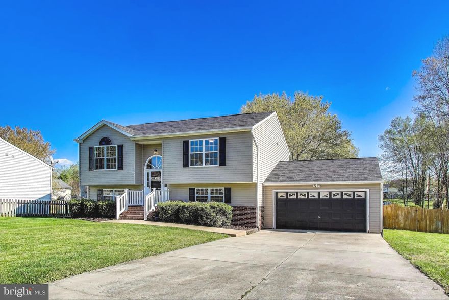 Welcome home to this beautifully updated and move-in ready split foyer nestled on a cul-de-sac in Fredericksburg! This spacious 4-bedroom, 2 full bathroom home sits on a gorgeous half-acre flat lot, offering privacy, space, and functionality both inside and out. Step into a bright and modern interior featuring brand new LVP flooring throughout, fresh paint, and recessed lighting that adds warmth and style. The fully renovated kitchen is a showstopper with quartz countertops, a stylish new backsplash, refreshed cabinets, and brand new stainless steel appliances—ready for you to cook, host, and enjoy. Both bathrooms have been thoughtfully refreshed, giving the home a clean and updated feel from top to bottom. Enjoy your morning coffee or entertain guests on the double decks overlooking the expansive backyard—perfect for summer BBQs, a play area, or even a future garden. The property also features a two-car garage and an extended driveway with space for up to six additional vehicles. Best of all? No HOA!