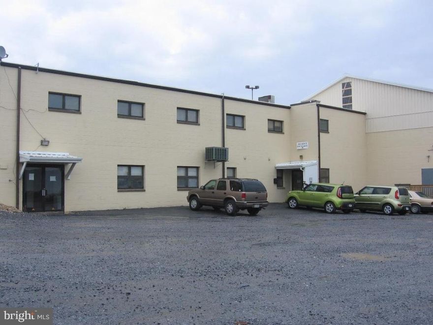 Warehouse with high ceilings of various heights, 15 docks, 3 drive-in doors, truck service bay, 2 story office and break room. 26+ acres with ample room for employee parking, truck maneuvering and storage. 4 miles to Turnpike and Rt. 222.