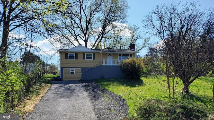 BACK ON THE MARKET!  Renovated 3 BR, 2 BA raised rambler located on quiet road among the serenity of trees and wildlife along the North Shenandoah River.  No HOA.  Fireplace insert from Belgium in lower level.   Sit back and relax on the full length front porch or spacious back patio.  Traditional floor plan includes living room, family room, rec room, 3 bedrooms on the upper level with full bathroom and kitchen and as a BONUS lower level includes a 2nd kitchen and possible in-law suite/office or home business.  Updated appliances, fixtures and granite counter in upper level kitchen.  Alternative septic system installed in 2024 and Owner is having system pumped and inspected mid April.  Roof replaced in 2022.  New water treatment system.  New pressure tank!  2x 50gallon AO Smith Signature Select hot water heaters.  Plenty of room for parking for family and friends to visit or for a home business owner.   Schedule your showing today