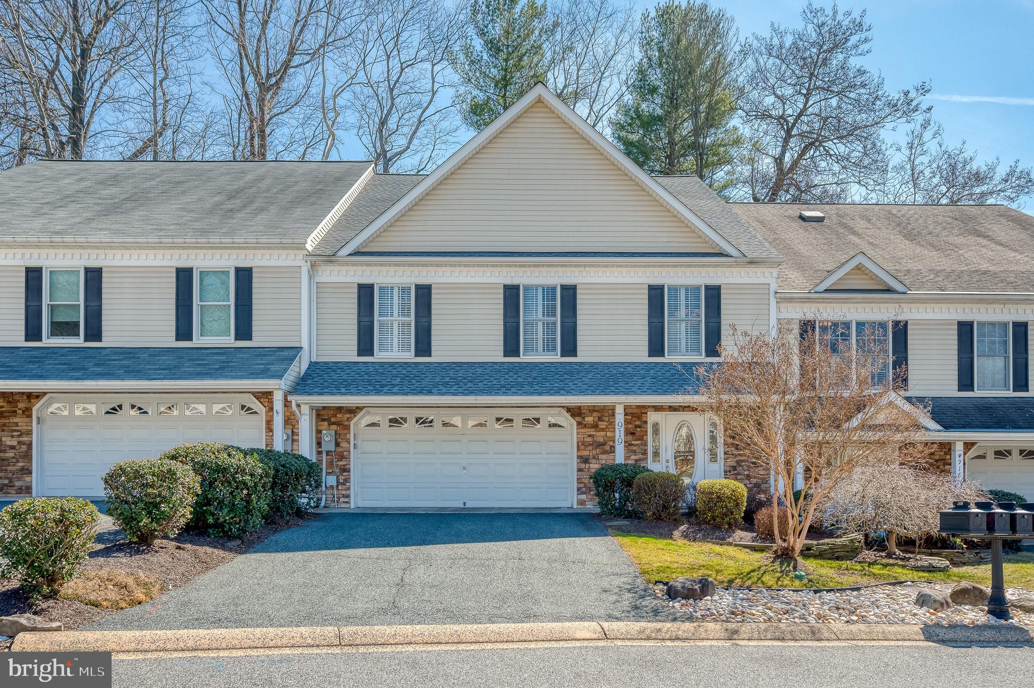 BACK ON THE MARKET! Backing to the first fairway of Maryland Golf & Country Club, this custom-designed three-story villa offers three spacious bedrooms and 3.5 bathrooms, making it the perfect retreat. Step into the marvelous two-level screened three-season room and soak in breathtaking views of the professional landscaping, including a tranquil waterfall and pond, along with the lush golf course behind. This home is a true masterpiece, featuring exquisite touches like three-inch granite counters, a sleek bar with lighted cabinetry and custom-built cherry bookcases. The attention to detail continues with California Closets, plantation shutters and built-in speakers on every level. Numerous recent updates include a new water heater (2020); refrigerator (2022); roof, gutters/gutterguards (2023); new (quiet) smart garage door (2024); washer/dryer (2024); furnace with humidifer (2024); dishwasher, microwave and induction stove (2025). This home offers both comfort and luxury at every turn. This one-of-a-kind villa is waiting for you to make it yours!