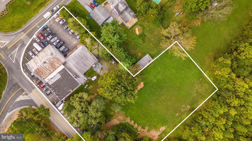 Massive 11,000 sq/ft building with 3 separate units on 1.76 acres of land with 1 acre being unused raw land on 600 feet of well traveled road frontage and zoned B2 with a multitude of business opportunities available under this zoning.  Lower level garage doors are 13 feet tall with 18+ foot ceilings and 4 vehicle lifts and upper level houses 4 vehicle lifts with 12 foot ceilings. Large vans and delivery trucks will access lower level garage effortlessly.  Owner has occupied the building for 27 years and has built up an incredible automotive shop and business.  All stationary equipment conveys including the 8 vehicle lifts.  All major systems have been completed and building has been very well maintained.  Amazing investment opportunity with fully built shop and land to expand!