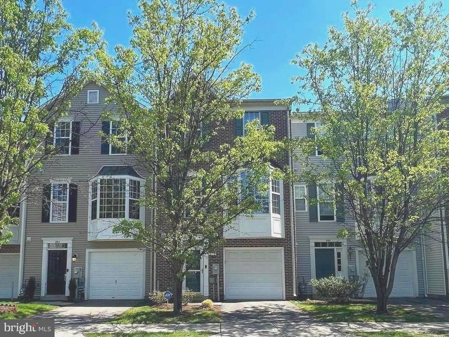 Brick front 3 level garage townhome in Crofton.  The beautiful home features wood floors on lower and main levels,  gourmet kitchen with upgraded countertops, large island  stainless steel appliances with gas cooking and plenty of cabinet and counter space. Slider to deck overlooking wooded area for added privacy.  Vaulted ceilings in master bedroom with attached master bathroom featuring a skylight for natural light, separate shower/tub and dual sinks.  Lower level large family room with gas fireplace and slider to rear fenced in yard.. Ample parking with attached garage, paved driveway and guest parking spaces. Community features two swimming pools, walking paths and basketball and volleyball courts. Minutes from Waugh Chapel Towne Center, The Village at Waugh Chapel and numerous restaurants and other retail stores.   Conveniently located to all major highways, Ft. Meade, DC, Baltimore & Annapolis.   Settlement must occur after 5/31/2025