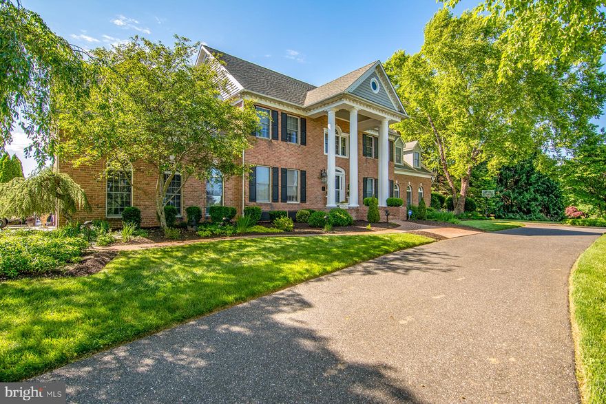 STATELY COLONIAL IN EXCLUSIVE TODD LAKES COMMUNITY! THIS HOME WAS BUILT FOR ENTERTAINING! FEATURES A BACKYARD OASIS WITH BUILT-IN HEATED SALTWATER POOL, PLENTY OF LOUNGE AREAS AROUND POOL, GAZEBO, COVERED SITTING AREA NEXT TO CABANA. VERY EXTENSIVE LANDSCAPING, MULTI-LEVEL BRICK & PAVER PATIOS WITH WALLS & RAISED PLANTERS. PLENTY OF PARKING ON LONG PAVED DRIVEWAY AND TWO-CAR SIDE-LOAD GARAGE. CONVENIENT CIRCULAR DRIVE IN FRONT OF THE HOME. COVERED FRONT PORCH WITH COLUMNS & BRICK WALKWAYS. ENTER INTO THE HOME VIA LARGE ENTRY FOYER WITH HOME OFFICE/ LIBRARY TO THE LEFT AND DINING ROOM TO THE RIGHT.  SPACIOUS GOURMET KITCHEN WITH ISLAND, BREAKFAST BAR, PANTRY, COFFEE BAR AND MUDROOM/LAUNDRY DOWN THE HALL.  ADJOINING SUN ROOM OVERLOOKING REAR PATIO & GARDENS. KITCHEN IS OPEN TO THE LARGE GREAT ROOM WITH NATURAL STONE FIREPLACE/PELLET STOVE INSERT.  TONS OF NATURAL LIGHT THANKS TO NUMEROUS WINDOWS & PATIO DOORS. SECOND FLOOR FEATURES EXPANSIVE OWNERS SUITE LARGE BEDROOM AREA, WALK-IN CLOSET & BONUS AREA FOR HOME OFFICE/GYM OR SITTING ROOM.  OWNER'S BATH FEATURES GORGEOUS CUSTOM TILE WORK, JETTED SOAKING TUB, DOUBLE VANITY & LINEN CLOSET.  TWO ADDITIONAL BEDROOMS AND FULL BATH IN HALLWAY.  AT THE END OF THE HALLWAY, THERE IS A GUEST SUITE WITH LARGE BEDROOM, SITTING AREA, WALK-IN CLOSET, VANITY AND FULL BATHROOM.  UP TO THE THIRD FLOOR - EXPANSIVE LOFT STYLE ROOM THAT COULD SERVE AS FIFTH BEDROOM, OFFICE, HOME GYM OR STUDIO. LOWER LEVEL FEATURES FAMILY ROOM WITH STONE FIREPLACE/PELLET STOVE INSERT, WET BAR, FULL BATH AND SEPARATE REC ROOM & STORAGE ROOM. FEATURES TWO-ZONE HVAC, CENTRAL VAC, PRE-WIRED FOR BACK-UP GENERATOR, NEW WATER TREATMENT SYSTEM. OVER 8,000 SQFT OF LIVING SPACE ON FOUR FINISHED LEVELS!! PRIVATE SETTING, YET VERY CONVENIENTLY LOCATED. JUST A SHORT DRIVE TO MARYLAND GOLF & COUNTRY CLUB!