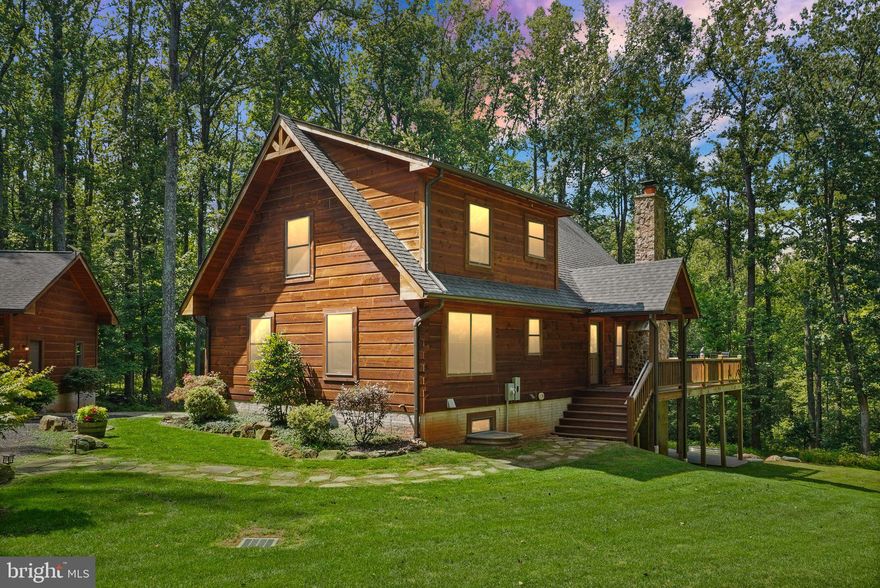 OPEN HOUSES CANCELLED. A primary residence can’t feel like a luxury, mountain-top vacation home, can it? Proudly presenting 6040 Pignut Mountain Drive, a luxury log cabin offering over 3300 finished sqft. and perfectly placed on 10, gorgeous mountain acres just minutes to the town of Warrenton. No detail was overlooked when this home was carefully designed and built in 2016. Three access points to the home’s main level are all under roof and the wrap-around porch provides so many different options for morning coffee, evening wine, or quiet chats with family. As you enter the home, the two-story ceilings and large window wall will take your breath away. Natural light floods the home and the mountain scenery is visible from each room. The kitchen provides granite counters, stainless steel appliances, and ample storage and counter space. A large dining area sits directly off the kitchen and provides the perfect place for family dinners. The large, living area is anchored by a gorgeous, stone fireplace making regular movie nights a must. Down the hall, a large mudroom/laundry room provides additional storage and outside access. Two, generous bedrooms are located on the main level, both with gorgeous beamed, ceilings. A large, full bathroom with a tub/shower combination complete the main level. Journey upstairs and find a comfortable, open loft area that overlooks the main level and also enjoys the mountain views. The private, primary suite is on the upper level and boasts tall ceilings, a walk-in closet, and a spa-like primary bathroom, equipped with a large soaker tub, stall shower, and double vanities. The basement provides so many wow factors. A large family room, anchored by pillars with stone harvested from the mountain! A full kitchenette and custom bar provide an entertaining space that your friends will all envy as you host and celebrate special occasions. Down the hall, a full bathroom with a custom barrel vanity and a breathtaking shower just takes the wow factor to another level. A fourth bedroom is located in the basement, as well as a flex space that is perfect for a gym, home office, or craft room. The basement utility room provides easy access to the home’s systems and a large, walk-out door gives access to the rear patio and hot tub area that will surely be a hit. The detached, 3-bay garage provides so many options for toy and tool storage, as well as workshop space. The home’s internet is provided by Starlink and that equipment conveys with the home. The home also has a whole-house generator for peace of mind. 2D floor plans are for reference only and should be considered estimates. The septic system was just pumped on 8/5/25 (see docs). Seller reserves the right to accept an offer at any time.