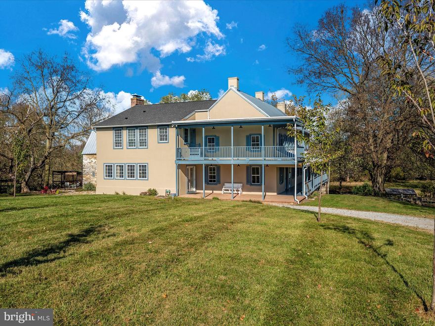 Spacious Manor home nestled on approximately 9.79 acres includes a cottage house, bunk house and bank barn. History and function meet beautifully in this near 6000 sq ft home. The updated kitchen includes white cabinetry, granite countertops, a wall oven, and center island with room to prepare a full banquet for holiday gatherings. The primary bedroom is fit for the head of the estate including a fireplace and an en suite bath with bidet, shower and soaking tub. The home boasts original pine hardwood floors, 5 original fireplaces, a huge recreation room, a butler’s pantry plus a main level laundry room. Great porches command the views of 9+ acres, an in-ground pool, partially fenced pastures, and a lovely bank barn with several upgrades, including a new roof. The separate cottage, equipped with a kitchen, living room, family room, 3 bedrooms and 2 baths has a deck overlooking the tranquil fields. The bunk house (former smokehouse) is perfect for a home office, studio or an overnight stay in the loft. The big red bank barn and the pastures can accommodate cows, horses, sheep and chickens. Previously the farmland was used to grow wheat and corn. This unique property has a rich history with so much to offer and is a rare find. Schedule your tour today to find out more. Note: The property does NOT require flood insurance. Letter of Map Amendment dated October 20, 2017 shows property buildings are in zone X.