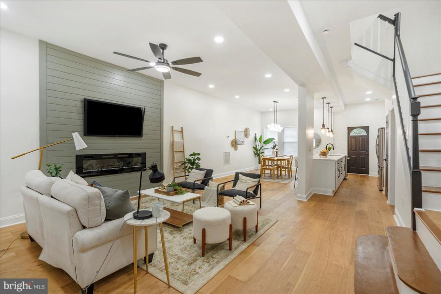 Welcome to 3400 Woodbrook Ave, a fully renovated 5-bedroom, 4.5-bath brick townhouse offering over 2,700 square feet of luxurious living space across four finished levels in the heart of Baltimore’s historic Greater Mondawmin neighborhood. This stunning 1920s home has been completely modernized in 2025 with a bright open-concept main level, a chef’s kitchen featuring granite countertops and stainless steel appliances, and four beautifully updated full baths. Highlights include a newly waterproofed basement with flexible living or guest space, a brand-new rear deck ideal for entertaining, and a detached two-car garage with additional rear parking. With new HVAC, central air, recessed lighting, and refinished hardwood floors throughout, this move-in ready home combines timeless charm with contemporary convenience. Located just minutes from Druid Hill Park, the Mondawmin Metro, and local shops, this is an exceptional opportunity to own a turnkey home in a vibrant urban community.