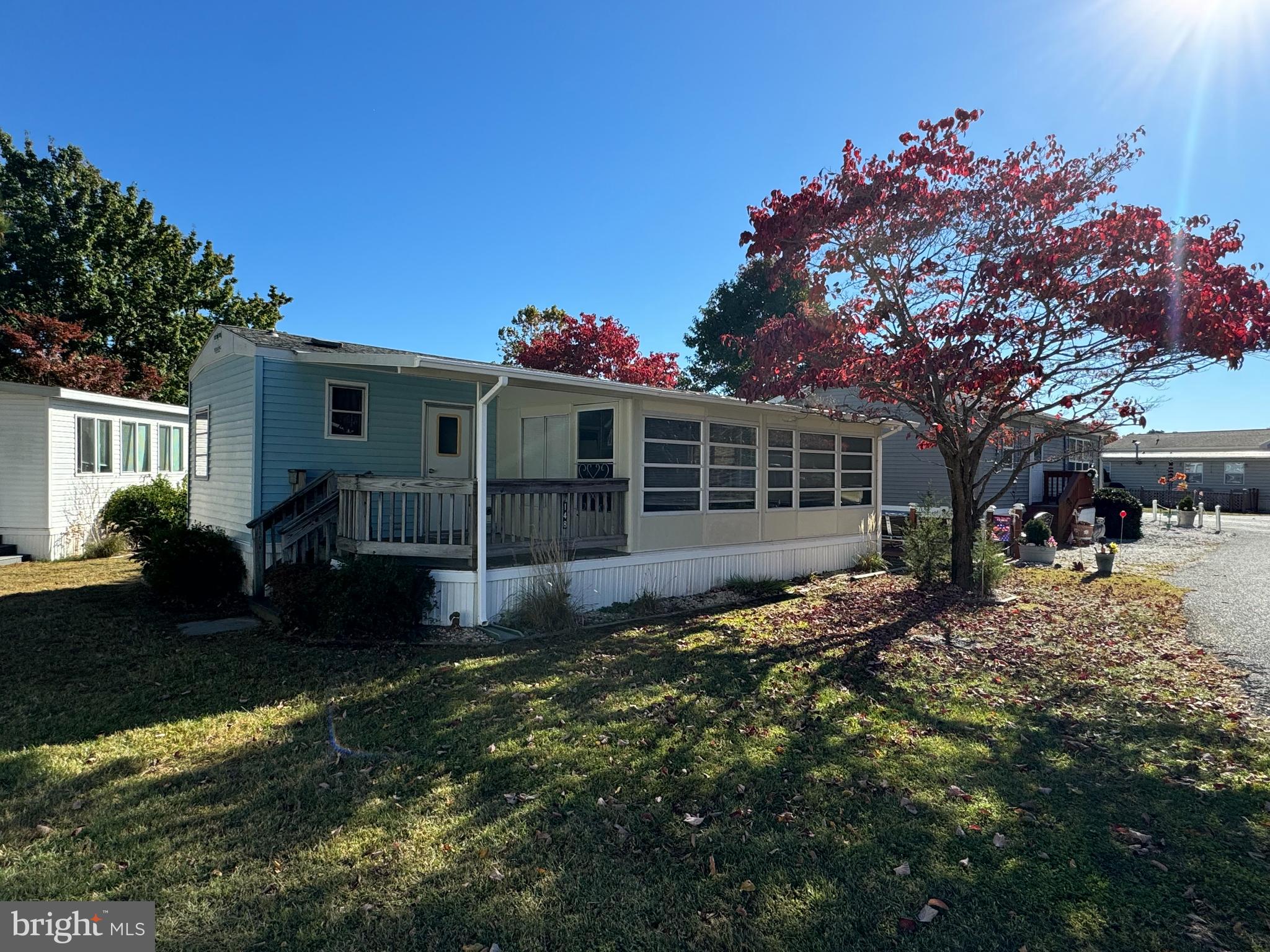 Awesome vacation get-away or second home! White Horse Park is a fantastic waterfront community that sits off the beaten path, yet just minutes to Ocean City! Boaters will love the option to have their boat, trailer or kayaks on-site for a small annual fee. Many other community amenities as well, including on-site management office, marina, outdoor pool, laundry facilities and separate community room. This home features three bedrooms, one full bath, a fully equipped kitchen with breakfast bar, electric range and full size fridge, new LVP floors throughout. From the living room, there are sliding doors to a full-width screened porch. There is a storage shed included. Sellers will provide boundary survey. Updates include roof 2014, central A/C 2016, water heater 2018, LVP floors 2024.