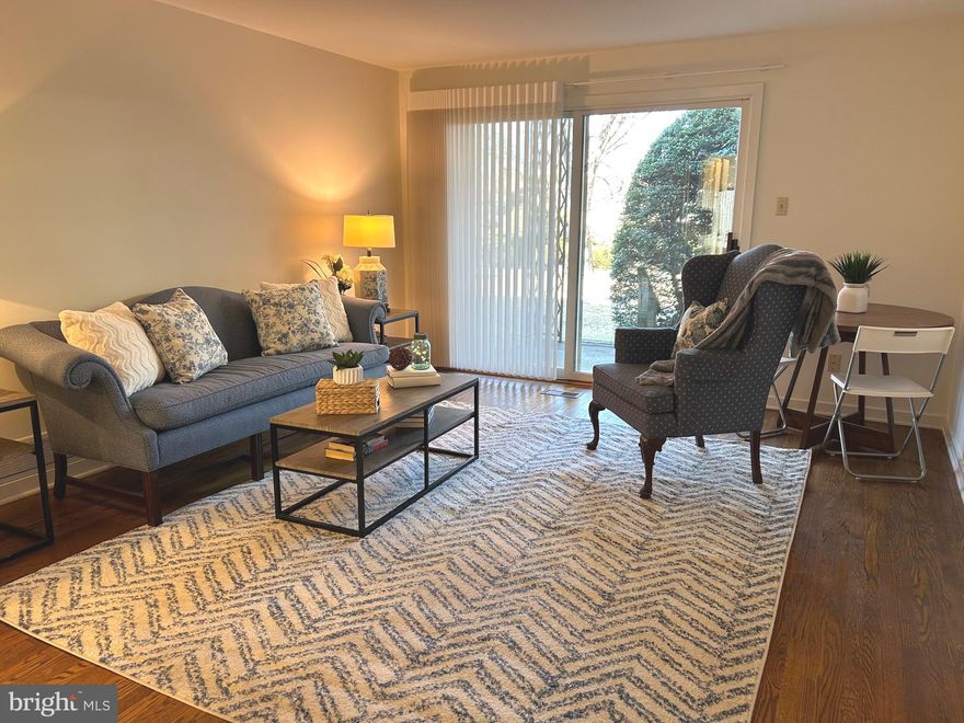 A sprawling, lush courtyard provides the idyllic setting for Mayflower Square Condominiums.  Conveniently located on Montgomery Ave in the heart of sought after Bryn Mawr, unit C-2 in this quiet private community is a meticulously maintained single-level home offering 2 bright, spacious bedrooms, 1 full bathroom, laundry in unit, central air conditioning, a private covered patio, an assigned garage parking spot,  and visitor parking.  Located in Lower Merion School District, the building's handsome brick facade and manicured landscaping create welcoming curb appeal out front.  Inside the unit, gleaming hardwood floors stretch across the large living room, there's plenty of space for entertaining and a lot of natural light from large sliding door overlooking the patio and courtyard.  The galley style kitchen features modern stainless steel appliances, generous cabinetry and a dining nook.  Down the hall is the full bathroom, laundry closet and a large carpeted primary bedroom with two  windows and good closet space.  The second bedroom is sunny and spacious with closets and the hall bath has a tub/shower.  The private patio  and picturesque courtyard are the ideal spots for barbecues, al fresco dining and relaxing.  This prime location is around the corner from top dining, shopping and entertainment along Lancaster Ave.  Villanova University and Bryn Mawr Hospital are both close by and there's easy access to I-476 and Center City Philly via the Paoli/Thorndale Rail Line at Rosemont Station. Convenient to Philadelphia International Airport.