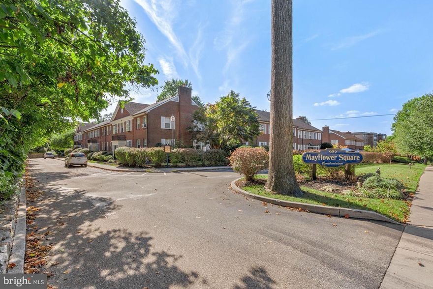 Freshly painted throughout, First Floor condo! A sprawling, lush courtyard provides the idyllic setting for Mayflower Square Condominiums.  Conveniently located on Montgomery Ave in the heart of sought after Bryn Mawr, unit C-2 in this quiet private community is a meticulously maintained single-level home offering 2 bright, spacious bedrooms, 1 full bathroom, laundry in unit, central air conditioning, a private covered patio, an assigned garage parking spot,  and visitor parking.  Located in Lower Merion School District, the building's handsome brick facade and manicured landscaping create welcoming curb appeal out front.  Inside the unit, gleaming hardwood floors stretch across the large living room, there's plenty of space for entertaining and a lot of natural light from large sliding door overlooking the patio and courtyard.  The galley style kitchen features modern stainless steel appliances, generous cabinetry and a dining nook.  Down the hall is the full bathroom, laundry closet and a large carpeted primary bedroom with two  windows and good closet space.  The second bedroom is sunny and spacious with hardwood flooring ,closets and the hall bath has a tub/shower and new tile floor.  The private patio  and picturesque courtyard are the ideal spots for barbecues, al fresco dining and relaxing.  This prime location is around the corner from top dining, shopping and entertainment along Lancaster Ave.  Villanova University and Bryn Mawr Hospital are both close by and there's easy access to I-476 and Center City Philly via the Paoli/Thorndale Rail Line at Rosemont Station. Convenient to Philadelphia International Airport.