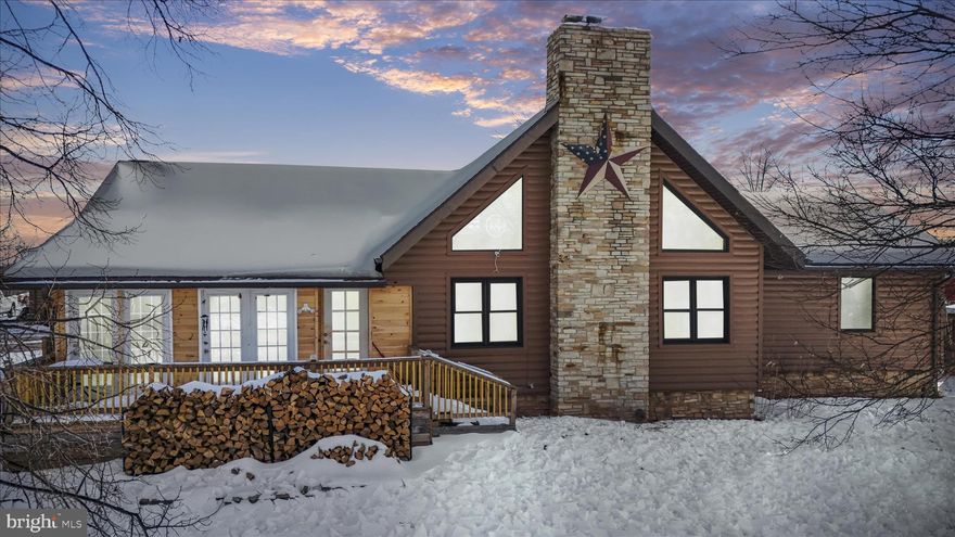 True horse property meets resort-style living in this fabulous custom-built log home set on over 5 acres of land with mountain views. Spend your mornings in the saddle and your afternoons by the saltwater in-ground pool (installed 2020), all in a setting designed for both everyday function and unforgettable gatherings.

The equestrian facilities are established and in active use. The property features a 90 x 70 riding arena positioned in front of the pole barn, 65’ round pen, a 39’ x 41’ pole barn with electric and water including feed room, tack room and hay storage, plus an additional 4-stall horse barn with electric and water. Property also hosts a chicken coop and duck area, goat pen with shelters, and a fenced area for household pets in the front of the home. In addition, a complete electric fence surrounds most of the property.

The kitchen is the heart of the home with custom cabinetry, stainless steel appliances, and generous counter space for cooking, seating, and entertaining. Enjoy immense storage, slide-out pantry space, and an additional eat-in area, currently styled as an office and coffee bar. Just off the kitchen, you will find a seasonal sunroom/enclosed porch filled with lots of natural light and beautiful views.

The great room delivers the wow factor with cathedral ceilings, exposed rafter beams, and a dramatic wood-burning floor-to-ceiling stone fireplace. Upstairs, the loft-level bedroom, currently used as a game room, overlooks the open and airy great room below.

An oversized primary suite featuring a walk-in closet and a private en-suite with a unique custom-tiled walk-in shower and separate soaking tub. Another main-level bedroom and a second full bath offer flexibility. The second bath features a walk-in shower and convenient dual access from both the kitchen and the second bedroom.

Everyday function is built-in with a main-level laundry room, and the convenience of central vacuum! The lower level offers a finished flex space ideal for a den, playroom, gym, or media lounge, plus over 2,000 sq ft of unfinished storage divided on both sides of the finished area, plus a second washer and dryer. An oversized detached garage adds even more flexibility, with an electric vehicle charger, 50 amp RV hookup, and an attached finished office or work space with high-speed commercial internet. Ideal for hobbies, a studio, or a home-based business.

A rare combination of proven equestrian function and staycation-worthy outdoor living, all in a beautiful mountain-view setting. Schedule your tour today!