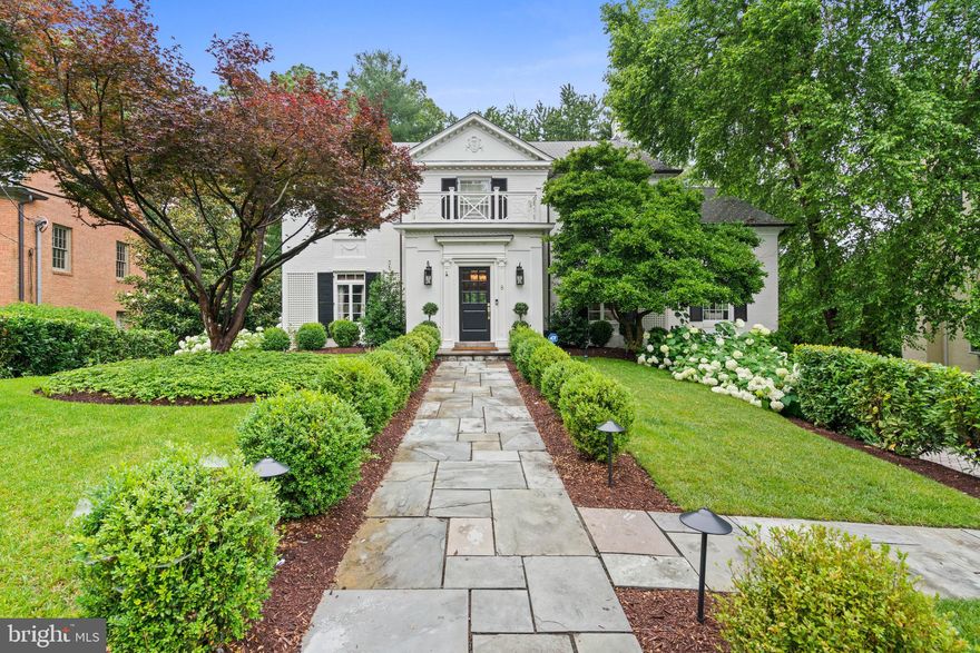 Sited on a tranquil, tree-lined cul-de-sac in one of Chevy Chase’s most sought-after neighborhoods, this distinguished six-bedroom Georgian-style residence offers a rare combination of privacy, scale, and convenience. The meticulously landscaped 0.43-acre lot places the home within close proximity to Rock Creek Park, downtown Bethesda and the shops and restaurants of Chevy Chase.

Spanning four finished levels, this residence is set back from the street and approached by a stone walkway. The entry foyer makes an immediate impression with a double-height ceiling, intricate millwork, and dual coat closets. Adjacent to this welcoming space, a private study with custom built-ins and a wet bar provides an elegant setting for work or a quiet retreat. The formal living room is expansive and light-filled, featuring crown moldings, oversized windows, and a fireplace with a marble surround. French doors extend the living space to a rear deck overlooking the landscaped backyard and pool.

The formal dining room, which can be closed off for added privacy, continues the home’s detailed millwork and connects seamlessly to the kitchen. Designed with both daily function and entertaining in mind, the updated chef’s kitchen is outfitted with a marble center island, dual sinks and ovens, a five-burner range, and extensive custom cabinetry. The adjacent family room offers built-in shelving, a fireplace, and an entire wall of windows showcasing tranquil views of the surrounding trees.

Upstairs, the primary suite features generous proportions, two spacious closets, and a renovated spa-inspired bathroom with dual vanities, a frameless glass shower, and a freestanding soaking tub. Three additional bedrooms complete this level, with one featuring an en-suite bath and the other two sharing a well-appointed hall bathroom. The third floor includes two more bedrooms with built-in desks, ample closet space, and a shared full bathroom.

The fully finished lower level enhances the home’s versatility with a sixth bedroom, full bathroom, fitness room, wine storage, and a large laundry room with direct access to the attached garage. A spacious recreation room with built-in shelving and a fireplace opens directly to the rear patio and upgraded pool, creating a seamless transition for indoor-outdoor living. The professionally landscaped backyard is designed for entertaining, with multiple seating areas and an ideal layout for gatherings and dining al fresco.

This exceptional residence masterfully blends timeless architecture with modern comfort, offering both refined interiors and expansive outdoor living. With its thoughtful design and desired location, it presents a rare opportunity to enjoy the very best of Chevy Chase living.