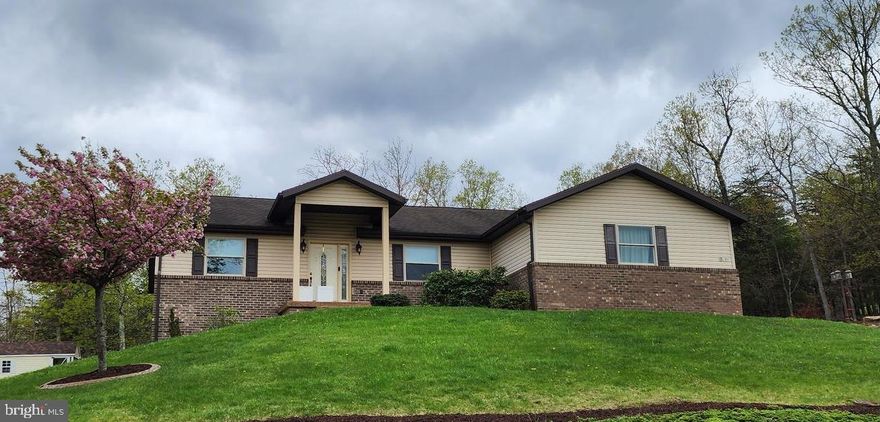 Immaculate custom-built home, meticulously maintained by its owner, offers a blend of luxury and practicality. Located in a serene setting with million-dollar mountain views, this residence epitomizes refined living. Enjoy the convenience of one-level living in an open floor plan adorned with cathedral ceilings, enhancing the spaciousness and elegance of every room. In-law Quarters: The lower level features a second kitchen and laundry, alongside a potential fourth bedroom, ideal for accommodating extended family or guests with privacy and comfort.  A rear patio provides an exceptional venue for entertaining, surrounded by the natural beauty of the landscape.  Discover a delightful surprise with the sunroom, offering a tranquil retreat bathed in natural light and scenic views. The gourmet kitchen is appointed with granite countertops and a breakfast bar, perfect for casual dining and culinary pursuits.  Separate dining room for formal gatherings and a conveniently located laundry area off the kitchen add to the home's functionality.  With 3.5 bathrooms, each designed with contemporary fixtures and finishes, comfort and convenience are assured.  The property includes two additional tax IDs, potentially offering additional land or investment opportunities. This home exemplifies luxury living with its thoughtful design, breathtaking views, and versatile living spaces, making it an exceptional choice for those seeking comfort and sophistication in every detail.