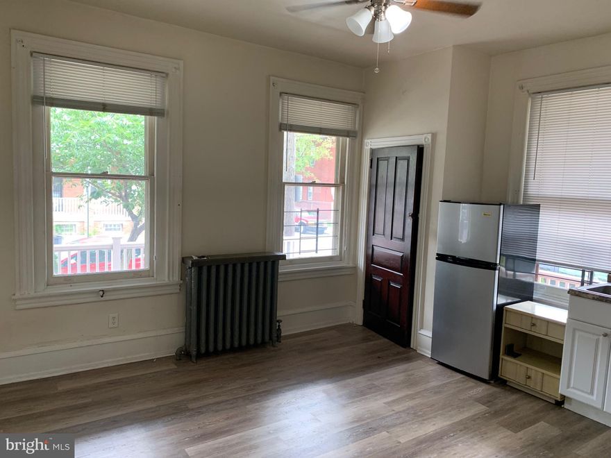 Immaculate first floor studio in a beautiful big house with a wrap around porch. There is tons of natural light because of front facing windows. The apartment has been freshly painted and has hardwood floors. High ceilings with a ceiling fan. Water and heat are included! Tenant pays only electric. Sorry no dogs, cats are ok with a $250 pet fee. Close to public transportation. This one won't last long!