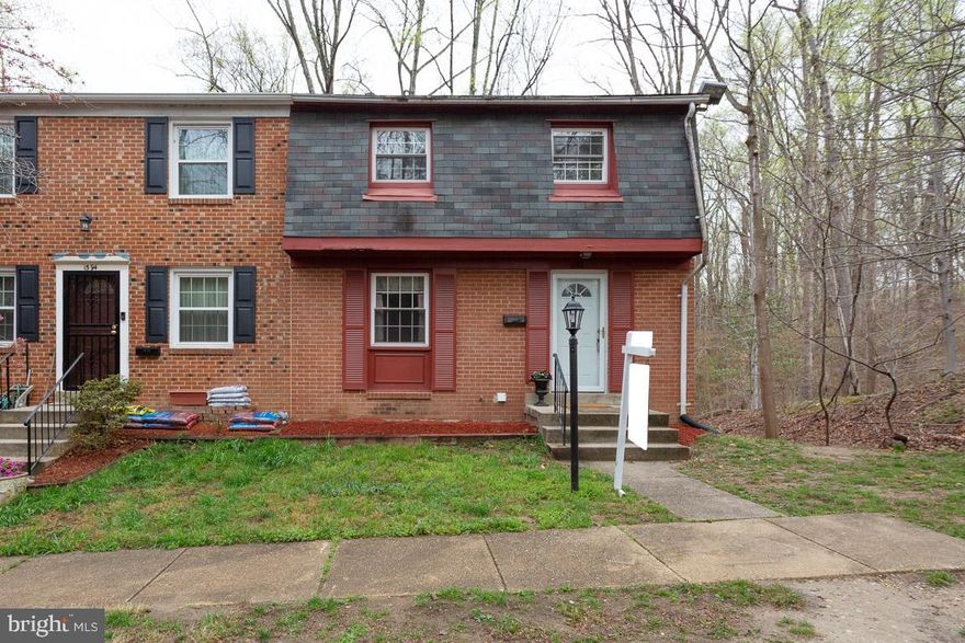 Wonderful END Townhome! With FRONT AND BACK YARD (fenced in with patio). This THREE LEVEL home has separate entry ways into the main house area and directly into the basement from the rear. The house is EXTREMELY SPACIOUS throughout with open concept kitchen area and dining area. Beautiful carpet in entire home! Comes with a washer and dyer in unit. Parking lot with assigned parking for your convenience. This is a wonderful home that shows EXTREMELY WELL.