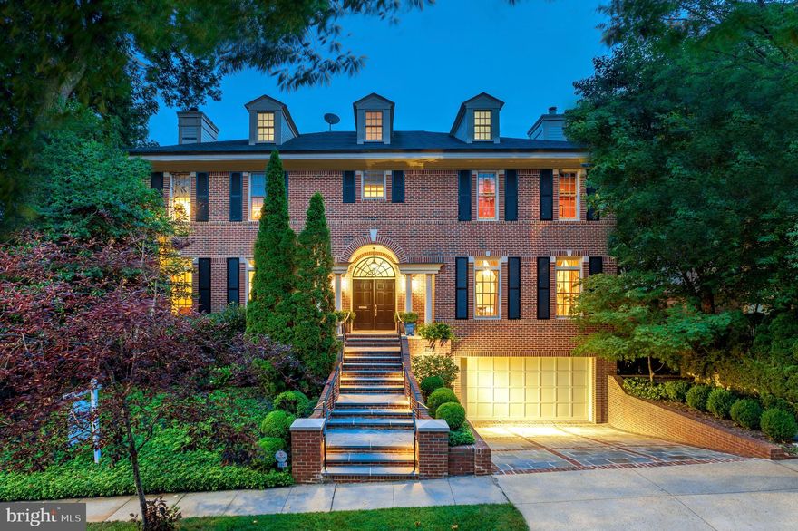 Stepping into this grand home is like returning to a more gracious era, when political opponents still came
together at the end of the work day to enjoy each other's company over cocktails and dinner. Its magnificent two-story foyer, with an impressive curving stair to a second floor overlook, its large common rooms, and terraced garden with pool -- all work in concert to create the perfect backdrop for entertaining on a sumptuous scale. On the entry level is a banquet-sized dining room, a sweeping living room with fireplace, a wood-paneled library, a sunroom opening to the terrace and a large eat-in kitchen with a butler's pantry. Upstairs is an owners' suite with a sitting room and large bedroom with separate "his and her" baths and dressing areas, plus two additional bedrooms and baths. The third floor has two more bedrooms and another bath; the lower level has a family room, office with full bath, a bedroom with its own bath, and laundry. An elevator serves the lower three levels, and there is a private driveway with a spacious two-car garage.