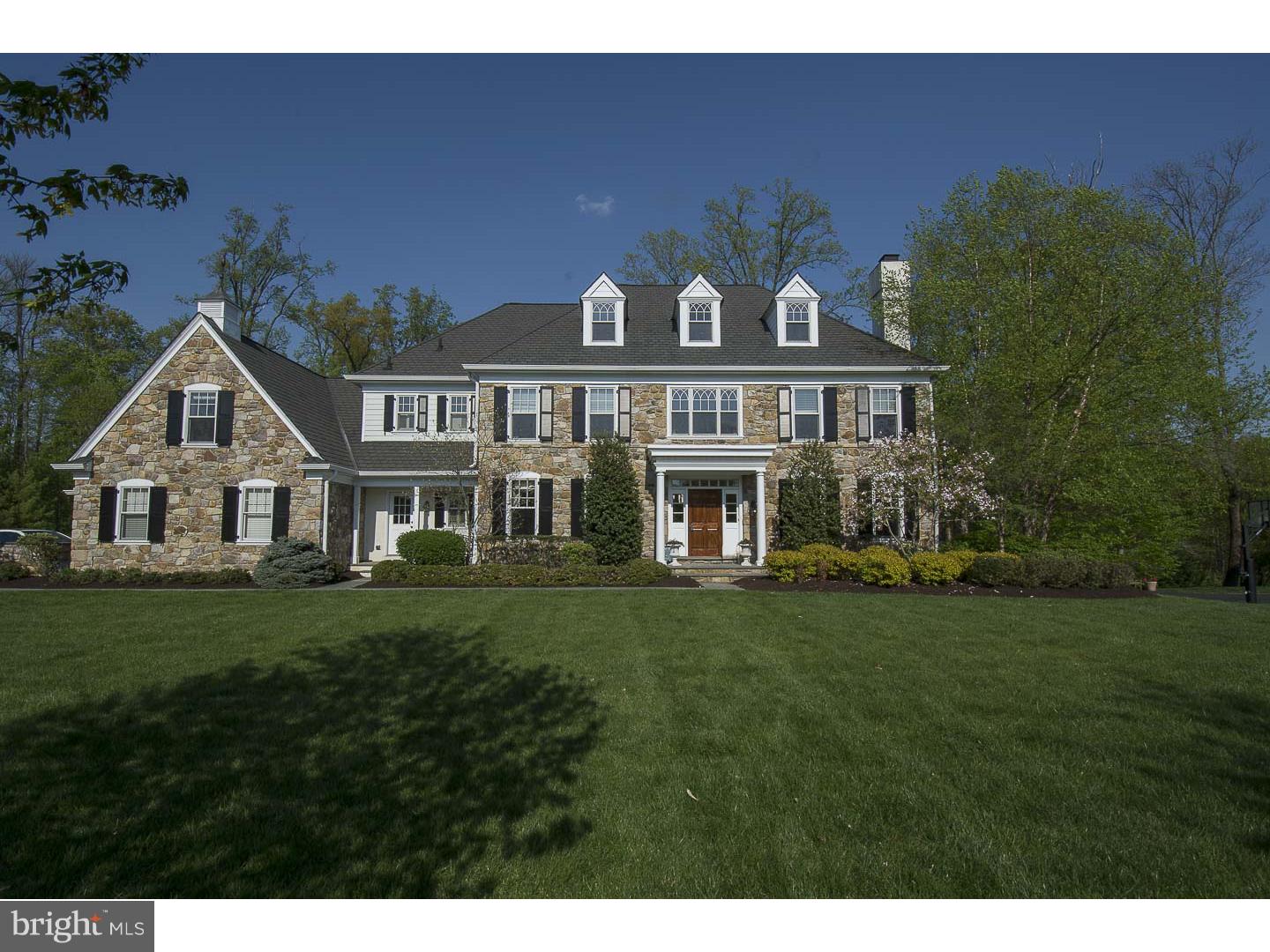 Situated on a generous acre homesite and located in the acclaimed "White Horse" community, this magnificent home was artfully designed by architect, Michael Visich and custom crafted by the award-winning Nolan Builders. Enter through the solid mahogany front door and be welcomed into a gracious foyer with sweeping staircase and beautiful wide-plank site-finished hardwood floors. You'll immediately begin to appreciate the fine craftsmanship and attention to detail throughout this elegant home. Unique architectural details including custom built-ins and moldings, rounded corners, and arched doorways accentuate the open floor plan and enhance the living spaces. The spacious Kitchen is outfitted with Woodmode cabinetry and top-of-the-line Wolf & Sub-Zero appliances, making cooking for quiet family meals or lavish dinner parties a breeze! A beautiful stone fireplace is the focal point of the sun-drenched Family Room which features a custom designed built-in entertainment cabinet. French Doors leading from the Breakfast Area or Family Room, enter onto a large flagstone terrace overlooking the lush green lawn and wooded backdrop, providing a delightful space to relax or entertain in privacy. Additional features of this residence include a luxurious Owner's Suite with tray ceiling, marble bath and large "his-and-her" walk-in closets, a private Study, elegant Living Room with second gas-burning fireplace, two Powder Rooms on the main level, finished walkout lower level and a partially-complete third floor which could easily be finished as additional living space. This spectacular home is located minutes from the campus of EA, the popular Main Line towns such as Berwyn, Wayne, Bryn Mawr, Newtown Square, Paoli and the prestigious Radnor Hunt Country. This residence is sure to impress even the most discerning homebuyers!