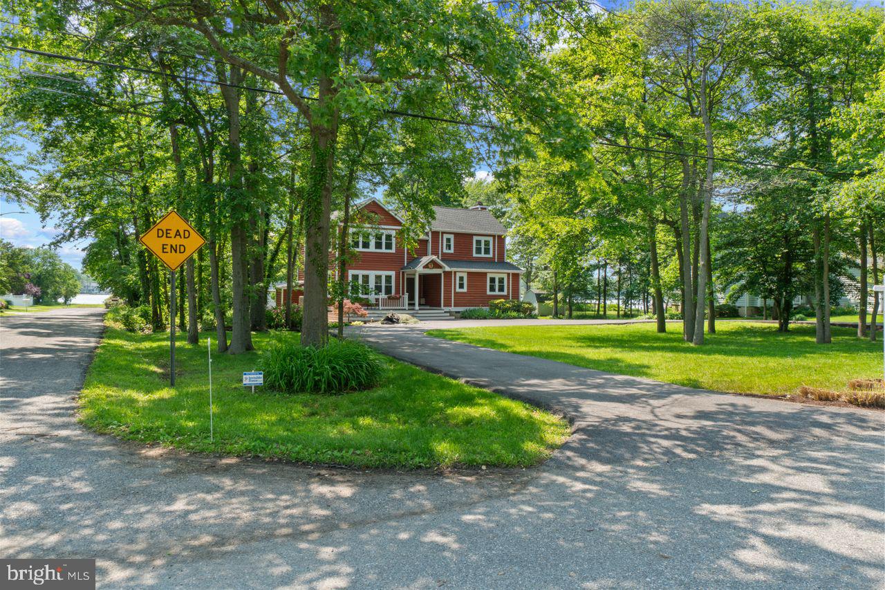 Your dream home in the coveted, water-privileged community of Arundel on the Bay is waiting!
Enjoy stunning, year-round water views of Fishing Creek just off the Chesapeake Bay from this beautifully designed four-bedroom, three-bathroom custom contemporary home. Perfectly positioned on an expansive 0.34-acre corner lot, the property is embraced by mature trees and lush landscaping, offering privacy, tranquility, and the feeling of a personal oasis. Expansive multi-level decks invite you to bask in breathtaking sunrises and sunsets, making everyday living feel like a getaway. Inside, the bright and immaculate interior features elegant hardwood floors, a brand-new window package (2023) flooding the home with natural light, and a warm, inviting ambiance throughout. The formal living room, centered around a cozy fireplace and framed by wide water views, offers the perfect place to gather, while the formal dining room boasts stylish built-ins for storage and charm. The open-concept kitchen is a chef’s delight, updated with crisp white cabinetry, neutral granite countertops, stainless steel appliances, and water views from the kitchen window. A cozy family room with a second fireplace extends from the kitchen, creating an inviting flow ideal for entertaining or everyday living. A main-level bedroom and updated full bath offer tremendous flexibility — ideal for guests, a home office, or multi-generational living. Upstairs, the primary suite is a true retreat, complete with water views, a fireplace, a luxurious spa-inspired bathroom featuring heated floors, a dual granite vanity, a freestanding soaking tub, and a large glass-enclosed shower. A custom-designed walk-in closet elevates the suite with style and function.
Two additional oversized bedrooms share an updated Jack-and-Jill bathroom, and one of the bedrooms leads out to a private upper deck — a perfect spot to enjoy your morning coffee while soaking in the serene views. A convenient second-floor laundry room adds thoughtful practicality. The home's outdoor spaces are equally impressive: professionally landscaped front and back yards, two outdoor sheds for kayaks, water toys, and garden equipment, and a newly paved circular driveway (2022) offering ample parking. Additional features include an automated doggie door, an electric pet fence, central A/C (2020), a new water system (2022), a washer and dryer (2022), and a new shed (2023) — ensuring peace of mind for years to come. Living in Arundel on the Bay means more than just a beautiful home — it’s a lifestyle. Residents enjoy exclusive access to a private, recently updated sandy beach, a boat ramp, a long pier with available boat slips, kayak and canoe racks, a basketball court, a playground, and picnic and grilling areas right along the Chesapeake Bay. Whether you're launching a paddleboard, taking a sunset sail, or simply enjoying the vibrant, coastal community spirit, you’ll experience the very best of waterfront living — all just minutes from downtown Annapolis, the Naval Academy, shopping, restaurants, and an easy commute to Washington D.C. and Baltimore. This is waterfront living without the hassle or cost — no flood insurance required. Your coastal dream home awaits at 3536 Saratoga Avenue!