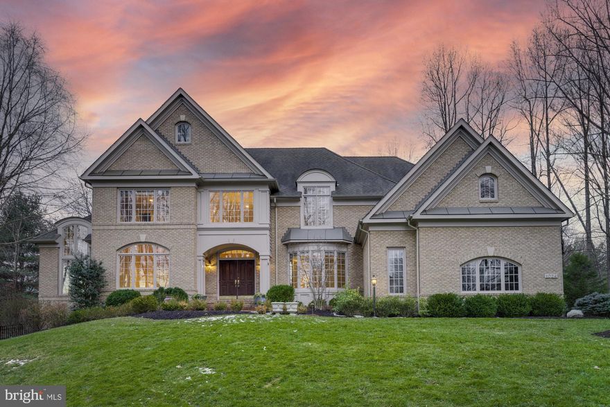 Elegant Estates at Longwood home sited on a private 1.38 acre lot. The sun-filled interior boasts $100K in recent upgrades, 5 bedrooms, 4.5 bathrooms and 7,200 finished square feet over three levels. An entertainer’s dream with an open floor plan, formal dining, butler’s pantry and living room. Bright gourmet kitchen with a large island opens to the breakfast room. Inviting two-story family room with built-ins, floor to ceiling windows and a gas fireplace. Sunroom with two story ceilings and soaring windows. Private home office with built-ins. Spacious owner’s suite with tray ceiling, sitting room, gas fireplace, private balcony, dual walk-in closets and spa-like en suite bath. En suite has 2 private toilet rooms. Three additional bedrooms, two full baths and a laundry room on the upper level. Finished lower level walks-out and boasts a recreation, wet bar, media room, 5th bedroom, exercise room and full bath. Enjoy outdoor living on the deck with a retractable awning, patio and expansive landscaped fenced back yard.  3 car side-load garage with car charging station.  Amazing Great Falls location convenient to restaurants, shopping, and commuter routes. Within the top rated Langley pyramid.