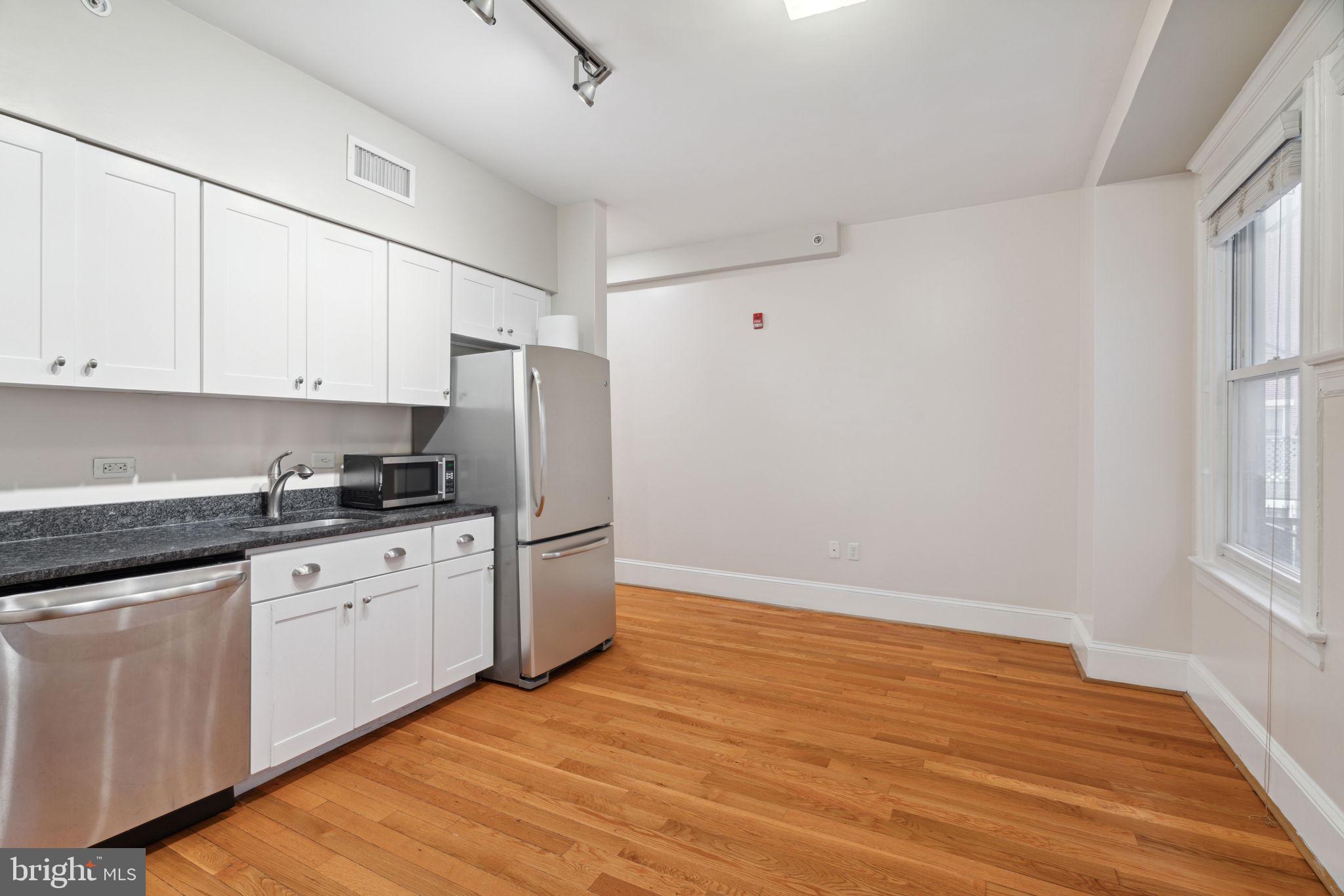 Boutique Rittenhouse Square apartment building with a secure entry and shared rooftop deck. This home is a like-new one bedroom residence featuring hardwood floors; an open kitchen with wood cabinetry, stainless steel appliances, and granite countertops; beautifully appointed bathroom with stall shower; and a stackable washer and dryer. Half a block from Rittenhouse Square, 1955 Locust is conveniently located steps from some of the city's best restaurants, shopping, the major office corridors, and public transportation.