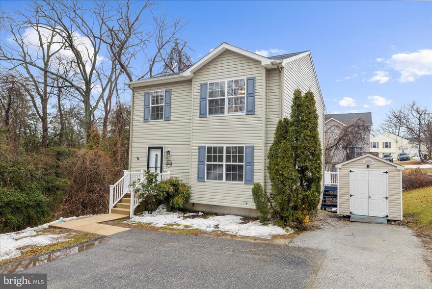 Welcome to 813 201st St, a beautifully maintained colonial-style residence in Pasadena, MD. This spacious 3-bed, 2 full & 2 half-bath home offers over 2,400 sq ft of living space across multiple levels, including a fully finished walk-out basement ideal for a family room, recreation space, or home office.  Step inside to discover a bright, open floor plan with newer luxury vinyl plank  flooring on the main and upper levels, and an inviting living area that flows to a well-appointed kitchen featuring cherry cabinets, granite countertops, a large breakfast bar, and stainless steel appliances — perfect for everyday living and entertaining.  The second floor hosts three comfortable bedrooms, including a primary suite with a recently updated bathroom. A private deck overlooks peaceful surroundings and water views, all on a quiet dead-end street.

Just minutes from commuter routes and local amenities, this home offers a perfect blend of suburban tranquility and accessibility. Don’t miss your chance to make this move-in ready gem your own!