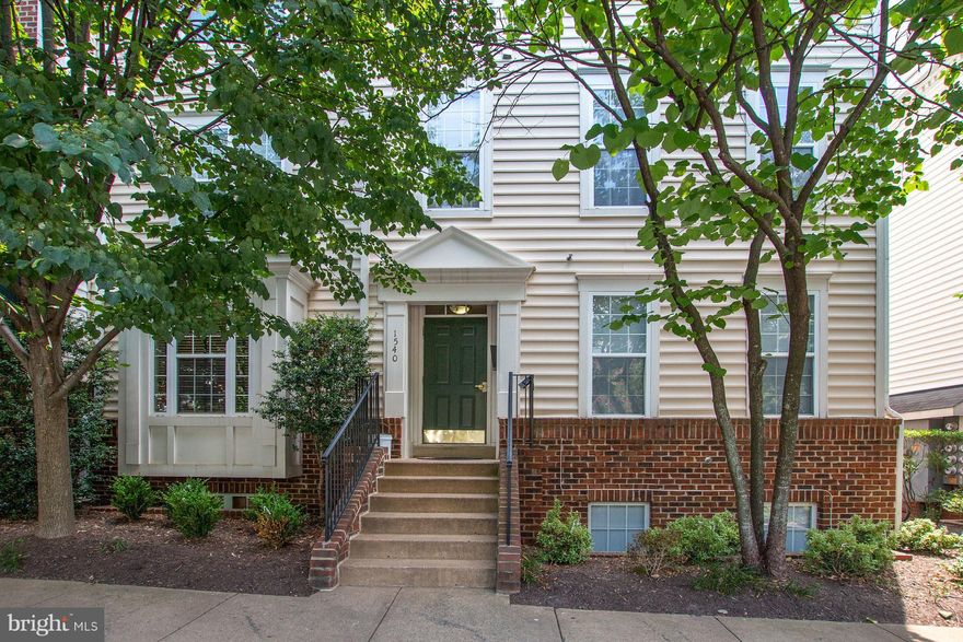 Renovated 2 lvl corner condo w/ balcony. New hrdwood on main level, Crown Molding; updated kit w/ Granite, Glass tile back-splash, Stainless Steel Appliances. Carpeted 2nd level feats. master bedroom w/ amazing vaulted ceiling, walk in closet & double sink en-suite master bath, 2nd spacious BR & guest bath, laundry room includes washer & dryer. Blocks to Metro &  Tyson's West Shopping Center.