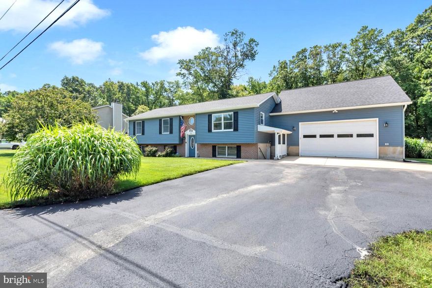 Tucked away in the peaceful community of Saunders Point is this expansive 3,000 + sq ft home offers an ideal blend of privacy, space, and versatility —perfect for multigenerational living or income potential! The current owners have extensively renovated this split-foyer home, significantly enhancing its living space and modern amenities, with an extended 500 SF for the Living/Great Room with Large Windows. A covered porch has also been added with staircase leading to the backyard and stamped concrete patio.
The Living/Great room adjoins the updated Kitchen and Dining area which makes for an abundance of space for large gatherings. The updated expanded Kitchen now includes a pantry, extra counter space, new appliances, a new backsplash and a new large island, a second sink of a coffee station or prep area. The 2nd level also offers 3 Bedrooms, improved Baths with walk-in showers and an additional Laundry room for added convenience. The lower level is ideal for an in-law apartment or Airbnb complete with 2 Bedrooms, Family room, Bath, Kitchen (with new SS appliances and backsplash), Laundry room and a private areaway access to outside parking. Owners completed renovations above the 2-car garage, located off of the Great room, with a Hobby room and Office plus a half-Bath and storage. Bonus room on the lower level off Living/Great Room adds another opportunity for your household needs with a full bath and wet bar that can be used as an efficiency or Airbnb income producing apartment. 
Beautiful backyard offers privacy with a fully fenced yard, landscaped to offer shade as well as space for a raised garden. There is also a large workshop with new lighting and a new roof. Additional Exterior Enhancements: The house was re-wrapped, insulated and has new siding and roof.
This charming home is located in welcoming Saunders Point community, offering a wealth of amenities for every lifestyle.  Spend your days relaxing on sandy and pristine Mayo beach, or enjoy fishing from the community pier.  Explore the beauty of Beverly Triton Nature Park, featuring a mile of peaceful shoreline, a playground for children, five miles of hiking trails.