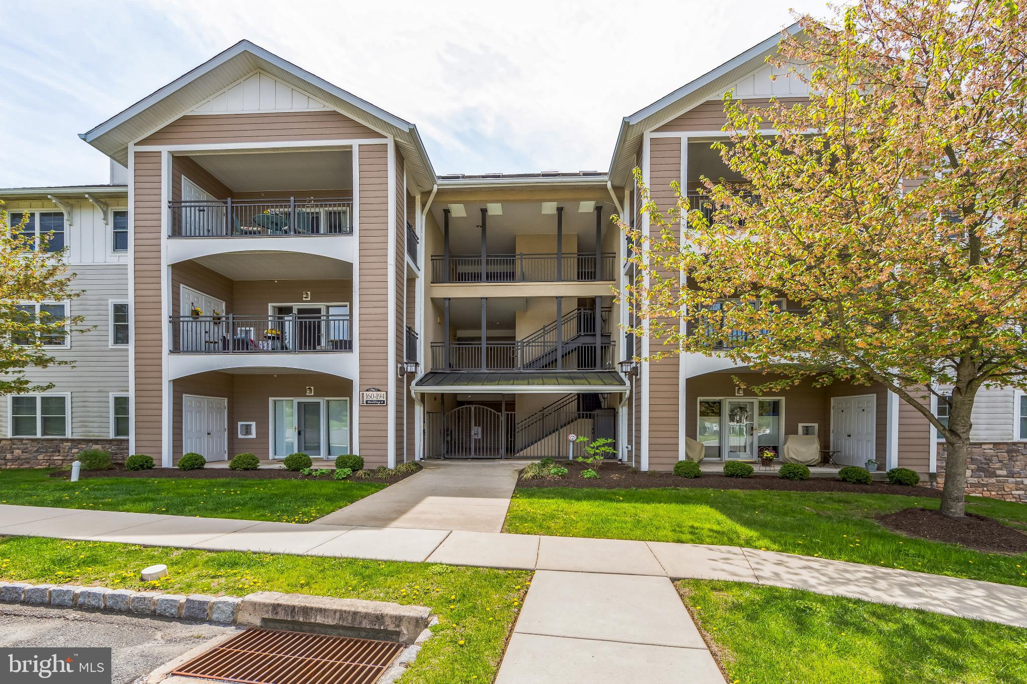 This inviting 1-bedroom, 1.5-bathroom home offers a spacious 1,032 sq. ft. of open floor plan living, perfect for relaxation and entertaining. Enjoy the warmth of a cozy fireplace and the convenience of in-unit laundry facilities. The kitchen is equipped with modern appliances, including a built-in microwave, dishwasher, disposal, and refrigerator, making meal prep a breeze. Step out onto your private balcony to savor morning coffee or unwind in the evening. Bucktown Crossing boasts an array of amenities that foster a vibrant community lifestyle. Take a refreshing dip in the outdoor pool, stay active in the fitness center, or challenge friends to a game of tennis. The clubhouse and community center are perfect for social gatherings, while the scenic bike trails and jog/walk paths invite you to explore the beautiful surroundings. Located in a welcoming neighborhood, residents enjoy easy access to local parks and essential public services. With reserved parking and a secure entrance, peace of mind is paramount. This home is not just a residence; it's a gateway to a fulfilling lifestyle in a community that values connection and comfort. Experience the best of senior living at Bucktown Crossing, where every day feels like a retreat. Showings begin Friday 9/26