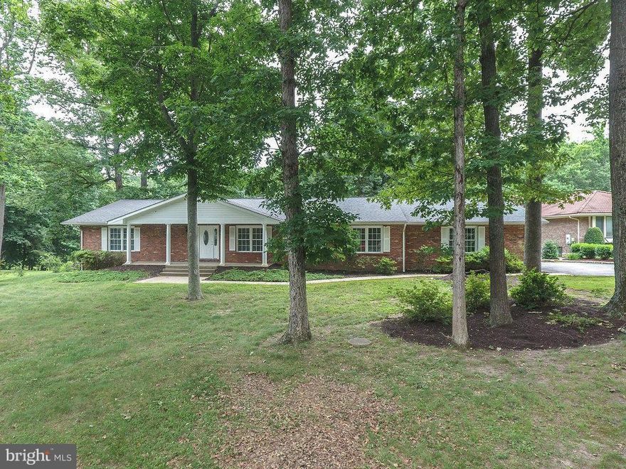 Incredible find in Northern Va.  Completely rebuilt from the studs up.  Massive single family ranch home with a full basement.  Home boasts 6 bedrooms, 4 and a half baths, and 2 great living spaces with wood burning fireplaces.  The home could be easily adapted to accommodate a wheel chair.  Brand new decking outside and a large fenced in yard that includes a small water view.  A MUST SEE HOME!