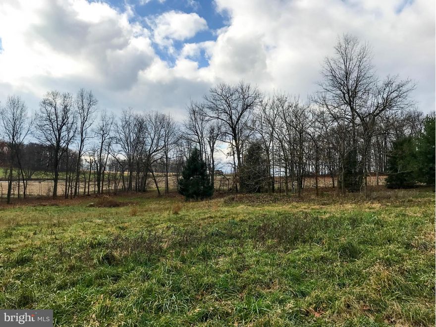 Beautiful, private 1.5 acre lot with septic and electric service on site. Mature trees and adjacent farmland offer a secluded natural setting for your dream home! No restrictions. Minutes to commuter routes and PA-MD line.