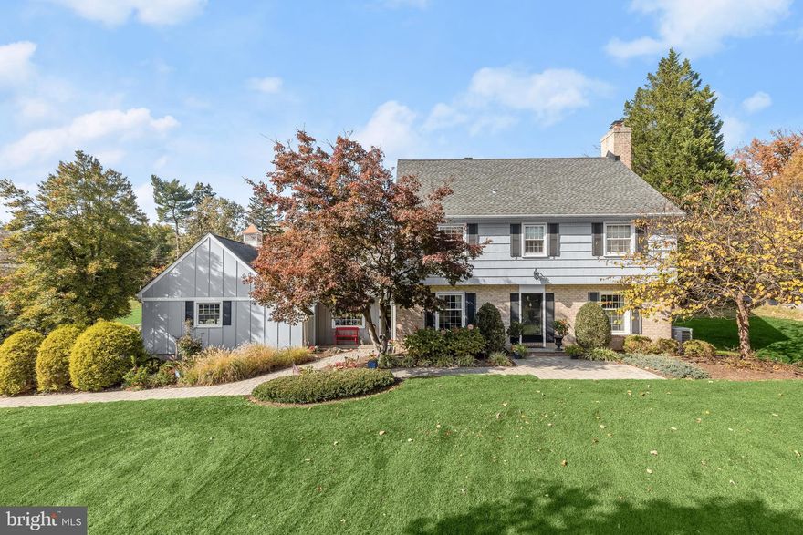 Welcome to this meticulously maintained home boasting exquisite details and thoughtful upgrades throughout.  The main level features hardwood flooring and accent molding, setting the stage for elegant living. Relax in the living room by a wood-burning fireplace, perfect for cozy evenings.  Discover culinary delight in the remodeled kitchen, adorned with granite countertops, white Shaker cabinets with lighted display shelves, stainless appliances, and a custom backsplash. The sun-filled breakfast room features beadboard and brick accent walls, offering charming ambiance and opens to a spectacular screened porch with a high vaulted ceiling with skylights and a brick floor, creating an ideal outdoor retreat.  Front and back entries offer easy access to the off-kitchen family room highlighting a wood-burning fireplace in black stone surround and a built-in bookshelf.  The 2nd-level boasts hardwood flooring throughout with the primary bedroom highlighting accent molding and a remodeled en suite bath featuring star tile flooring and an oversized, frameless shower.  Three additional bedrooms and a full bath complete this level. Ascend the stairs to the top level offering a spacious bedroom with a built-in workstation, a full bath, zoned HVAC, a huge storage room, and eaves for additional storage.  The lower level provides a recreation room with a wet bar, a flex room, abundant storage space, and walk-up stairs to the backyard.  Outside, enjoy the expansive maintenance free, bi-level deck with a hot tub overlooking the level, professionally landscaped, backyard with a custom garden surrounded by a decorative slate retaining wall, complete with a firepit, play area, and storage shed, designed to match the home.  The driveway has been recently sealed, and the spacious 2-car garage finished with an epoxied floor and features a new brass heron in flight on the cupola.  Some additional features include a direct line natural gas Generac generator, and an architectural shingle roof.