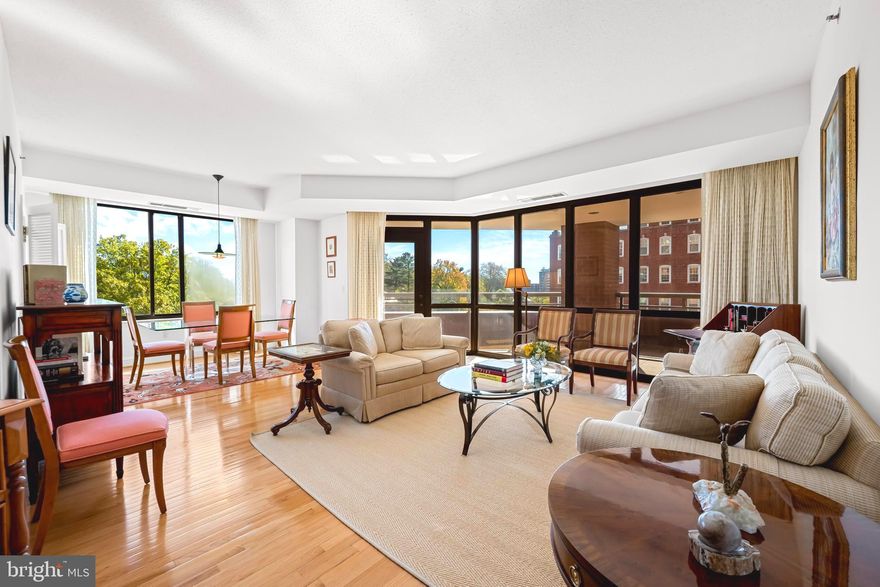 Come Visit and Fall in Love! Welcome to this turn-key, light-filled condominium featuring 2 spacious bedrooms and 2.5 baths in The St. James—an exclusive, full-service building just steps from Johns Hopkins University in the heart of charming Guilford. As you enter, you’ll immediately feel the warmth and elegance of this southern facing corner unit, where an inviting foyer with a convenient coat closet and powder room leads to a gracious open living and dining area framed by walls of windows and wonderful views. Step outside to enjoy your own private, wraparound balcony—perfect for morning coffee or evening relaxation. The updated kitchen offers granite countertops, recessed lights and stainless steel appliances. The spacious primary suite includes a large walk-in closet with a dressing area, double vanity, and an en-suite bath featuring a jetted tub and separate shower. The second bedroom also includes its own full bath with a tub/shower combination. A full-size washer and dryer are located in the large utility room, which also provides additional storage space. Building amenities include a doorman, front desk reception, outdoor pool, fitness center, library, meeting room, one garage parking space, one covered carport space, and an additional storage unit. Conveniently located near JHU, the Baltimore Museum of Art, restaurants, cafés, and more. Pet-friendly building—bring your dog or cat!