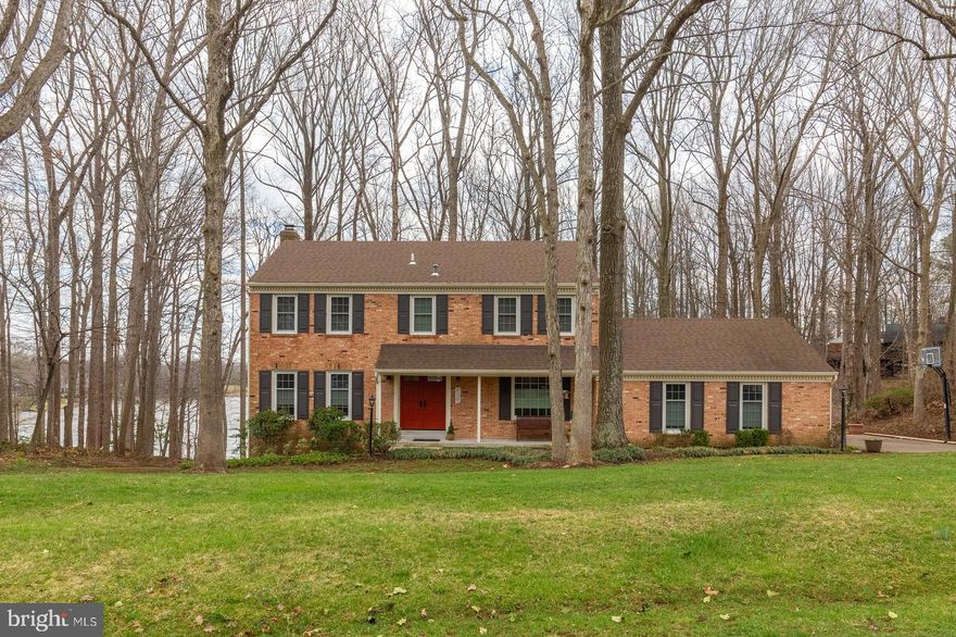 This stunning brick front colonial sits on a half-acre wooded lot with spectacular views of the Lake from all three levels! The home boasts a front porch, two decks in the rear and an oversized two-car garage! The home has 4 good size bedrooms and 2 full and 2 half renovated bathrooms! The Master has an ensuite bath, walk-in closet and attached sitting room/nursery that overlooks the Lake! Kitchen has been updated with solid maple cabinets, granite countertops and stainless steel appliances. Exterior has also been completely renovated with a new roof, vinyl siding, shutters, windows and doors, gutters with leaf guards, garage door and concrete walkway. Just a short two-to three minute walk will take you to West Beach where you can swim in the lake, play on a sandy beach, fish from the dock and store your kayaks/canoes for in-season fun!! Hurry this is a fabulous opportunity to own a completely renovated water view home!!