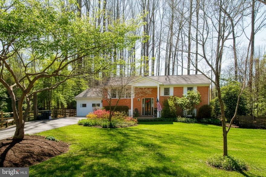 Discover the perfect blend of convenience and tranquility in this stunning all-brick home, ideally located just minutes from I-66 and Fairfax County Parkway. Nestled on nearly an acre in a quiet cul-de-sac, this beautifully wooded property offers exceptional privacy in a rare no-HOA community. This is an absolute haven for bird and wildlife enthusiasts.

The charming front porch sets the tone for peaceful mornings with coffee, while the back porch is perfectly designed for relaxing evenings under the stars. Inside, the upper level showcases gleaming hardwood floors throughout. The elegant living room is filled with natural light from a large picture window and features a cozy wood-burning fireplace with a classic mantle.

The spacious kitchen is both functional and inviting, featuring rich maple cabinetry, Corian countertops, and a stunning 48" Andersen casement window overlooking the serene backyard. Additionally, the French wood sliding door leads to an expansive rear deck spanning the length of the home. This layout is perfect for entertaining or enjoying quiet outdoor moments with family and friends.

Step outside to the private backyard retreat, where mature trees create a peaceful, park-like setting. A charming swing set offers the ideal space for children to play and explore, adding to the home’s warm, family-friendly appeal.

This upper level of the home also includes three generously sized bedrooms, and two beautifully updated bathrooms.

The lower level offers a warm and versatile living space with a large family room, complete with a second wood-burning fireplace, custom built-ins, and a dedicated desk area ideal for work, study, or creative projects. A third full bathroom adds convenience, along with an additional room that can serve as a fourth bedroom or private office.

Completing the home is an expansive workshop and storage area with direct walk-out access to a charming stone side patio. This is ideal for hobbies, projects, or additional outdoor enjoyment.

With room for everyone and surrounded by nature, this welcoming property is truly a private retreat you must experience in person!