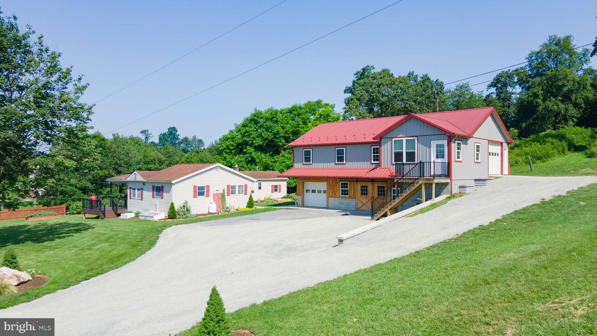 **This property will be offered at Public Auction on August 21, 2025 @ 6:00 PM. The listing price is the suggested opening bid only and in no way reflects the final sales price. $35,000 Deposit due on auction date. 2% transfer tax to be paid by the purchaser. Settlement on or before October 7, 2025**Stand at the deck and breathe in quiet country air—your Quarryville homestead awaits! Set on a manicured ½‑acre that borders open farm ground, this 2021‑remodeled 3 BR / 2 BA home blends modern comfort with pastoral charm. Inside, a sun‑splashed kitchen‑dining space anchors daily life, with a partial basement with cold cellar stands ready for canning or storage. Step outside to a 12′ × 18′ deck overlooking berry canes, grapevines, and a tidy vegetable garden. Equestrians and entrepreneurs alike will love the brand‑new 36′ × 50′ horse barn—two large stalls, insulated 2nd‑floor workshop, finished offices with mini‑split HVAC, level‑entry garage, plus an 18′ × 30′ shop. All buildings are fully wired for today’s tech.  Seize Lancaster County living at 220 Clearview Drive!