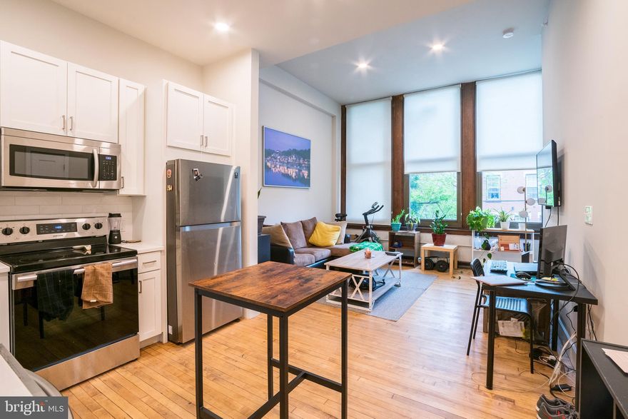 *Available 6/1*

This unit has soaring high ceilings with three oversized windows that illuminates the open floor plan living room. The bright white kitchen features texted white subway tiles with white quartz counter tops and a complete stainless steel appliance package. Right off the kitchen is the the full bathroom with a modern tiled shower/tub and vanity that matches the kitchen. There is a deep laundry closet near the entry of the unit, plus a storage closet within the living area. Tucked away is the the bedroom, which includes a large closet and another large window providing great natural light. You control the cooling and heating with the unit's mini-split system.

The Walter George Smith Public School, listed on the National Register of Historic Places, has undergone an amazing transformation to bring you these luxury apartments! Each unit features high end finishes while preserving it’s historic character such as the chalkboards, original trim and closets, and overall unique floor plan. All tenants will have access to the two outdoor spaces (over half an acre combined!) on ground floor and mezzanine patios, and roof deck with stellar skyline views! Located at 19th and Wharton in Point Breeze, you’ll be minutes from the OCF Coffee House, American Sardine Bar, Graduate Hospital, East Passyunk and MORE!

Lease Terms: Generally, 1st month, and 1 month security deposit due at, or prior to, lease signing. Other terms may be required by Landlord such as last month's rent upfront. $65 application fee per applicant. Tenants are responsible for: electricity, gas (if applicable), cable/internet and $10/mo technology fee. Water is a flat monthly fee of $60. Additional fees or requirements may be applicable for units with Homeowners or Condo Associations. Landlord Requirements: Applicants to make 3x the monthly rent in verifiable gross income, credit history to be considered, no evictions within the past 5 years, and must have a verifiable rental history with on-time rental payments. Exceptions to this criteria may exist under the law and will be considered. Cosigners will be considered.

*Price reflects the net effective rent when a 2-week credit is applied at $1,500/mo.
*Sorry, no cats, 1 dog under 45 lbs OK; $50/mo pet fee required
*Photos of a similar unit. Finishes may vary.