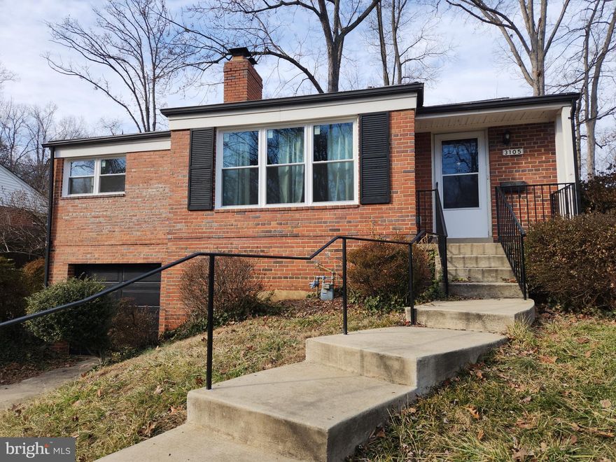 Classic solid brick home facing wooded area with creek**Cozy wood burning brick fireplace**Newly updated kitchen with granite counter tops and stainless steel appliances**New Deck**New energy efficient windows**Hardwood floors throughout the main level**Finished high ceiling basement with bath** Garage, plus driveway, and plenty of street parking  **Large fenced backyard** On quiet circular street with no cut through traffic**