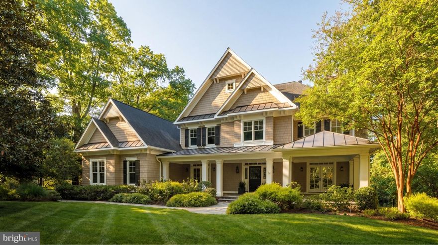 Set on a beautifully landscaped one-acre lot in the heart of McLean, 6719 Wemberly Way is a custom estate that blends timeless transitional design with warm, generously proportioned interiors and a private outdoor retreat. Spanning nearly 10,000 finished square feet, the home was designed to accommodate both daily living and large-scale entertaining. Mature landscaping and manicured grounds create a natural sense of privacy throughout, where an outdoor pool, lounge areas, and covered outdoor living spaces form a secluded setting.

A two-story foyer introduces interiors defined by generous scale, rich hardwood flooring, custom millwork, and abundant natural light. Formal living and dining rooms extend off the central hall, while the rear of the home unfolds into expansive informal spaces designed for seamless everyday living and entertaining. Coffered ceilings, oversized windows, curated built-ins, and refined detailing carry throughout, with rear-facing rooms opening directly to the covered terrace and poolside patios, creating a seamless connection to the surrounding landscape.

At the heart of the home, the kitchen is anchored by dual oversized islands and designed for both function and gathering. It features custom inset cabinetry, glass display storage, integrated appliances, and sweeping stone surfaces. The professional appliance package includes Sub-Zero refrigeration, Wolf double ovens and gas cooking, a Miele dishwasher, and integrated beverage refrigeration. A marble herringbone backsplash and custom hood add texture and warmth, while the breakfast room opens directly to the terrace.

The family room extends from the kitchen with custom built-ins, a fireplace, and direct access to the covered porch and outdoor living areas. From there, the rear terrace transitions to an integrated grilling and fireside gathering space before continuing to the pool and surrounding grounds below. Mature trees, layered landscaping, manicured hedges, and open lawn areas frame the outdoor setting. 

A well-planned service wing includes a mudroom with custom built-ins, dual powder rooms, pantry storage, and entry to the three-car garage with an integrated pet washing station. A private office and separate den provide additional flexibility for work, reading, or lounge use.

Upstairs, the primary suite occupies its own wing and includes a tray-ceiling bedroom with a fireplace, a separate sitting area overlooking the rear grounds, an expansive walk-in dressing room with custom built-ins, and a secondary walk-in closet. The marble bath features dual vanities, a soaking tub, and an oversized shower. Four additional bedroom suites complete the level, each with ensuite baths and walk-in closets outfitted with Elfa closet systems, along with a secondary laundry room.

The walkout lower level expands the home’s living space with a large recreation room, game area, wet bar, guest suite, full bath, and wide-ranging storage. Open areas allow for fitness, media, or additional lounge configurations, with direct access to the backyard and pool.

Privately sited and thoughtfully executed throughout, 6719 Wemberly Way offers a refined McLean residence defined by scale, privacy, and a strong connection between interior living spaces and resort-style outdoor living.