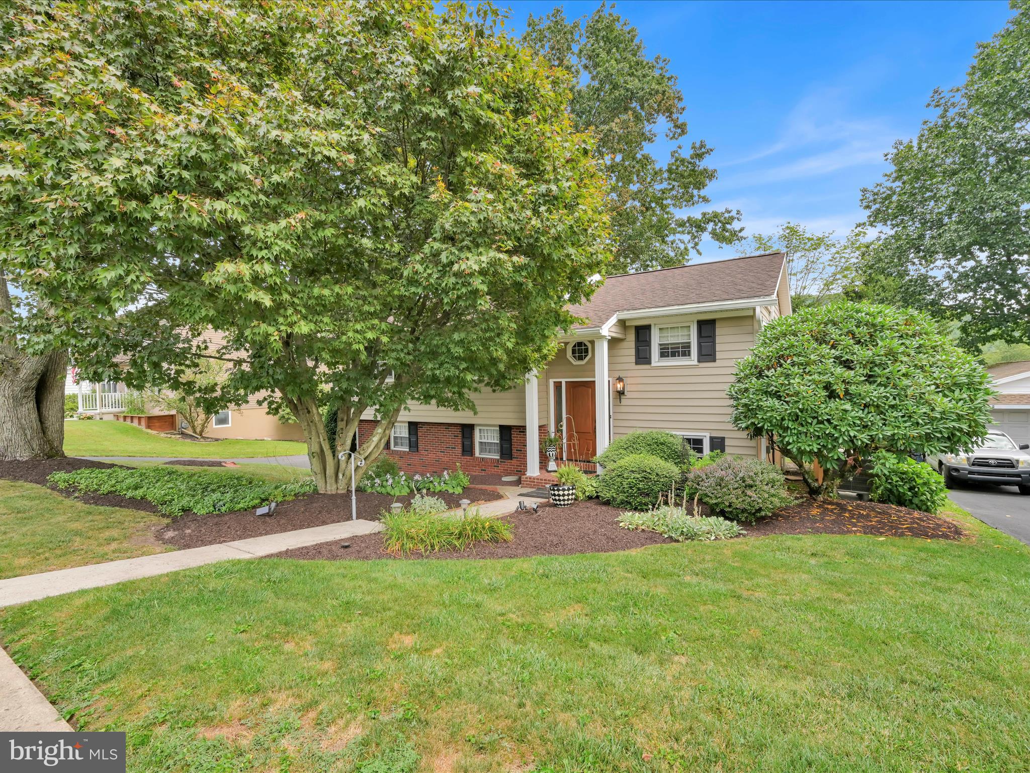 Welcome to this inviting three-bedroom, 1.5 bath bi-level home in the lovely Forest Hills Development, where charm, functionality, and location come together to create the perfect setting for everyday living. Perched on a 0.22-acre professionally landscaped lot in a well-kept neighborhood with sidewalks, streetlights, and a community playground, this home is designed to deliver both comfort and convenience—and it even comes with the added peace of mind of a Home Warranty included for the new owner. As you arrive, you’ll appreciate the neighborhood’s welcoming feel—ideal for morning jogs, evening strolls, or bike rides to the playground. Step inside to the main level, where the living room and dining area blend seamlessly, creating an open, airy feel that’s perfect for both casual gatherings and formal entertaining. Natural light streams in through large windows, casting a warm glow over the space, while hardwood floors lie hidden beneath the main-level wall-to-wall carpet, offering the opportunity to easily reveal classic beauty and timeless appeal. The dining area features sliding doors that open directly onto a large deck, extending your living space outdoors for summer barbecues, morning coffee, or simply relaxing while overlooking the backyard. The kitchen is thoughtfully designed with granite countertops, a pantry closet for extra storage, and just the right amount of workspace to make meal preparation easy and efficient. Cove molding & newer wood interior doors add a quiet ambiance. The full bath (remodeled in 2023) serves this level and is conveniently located near the bedrooms. The lower level of this home is where the versatility truly shines. A bonus room provides an adaptable space that could serve as a home office, craft room, workout area, or even a 4th bedroom. The family room offers a cozy and welcoming atmosphere with a beautiful brick fireplace.. The family room flows into a spacious three-seasons room, a bright, enclosed space surrounded by windows—perfect for enjoying the outdoors without worrying about weather or bugs. Whether used for casual dining, entertaining, or as a sunny reading lounge, this room will quickly become a favorite year-round retreat. The lower level also includes a laundry/utility room, keeping chores tucked neatly out of the main living areas while providing easy access to mechanical systems and extra storage. A half bath adds convenience. The home’s oversized one-car garage offers not just parking but room for bikes, tools, or workshop space, and the driveway provides additional off-street parking for guests . The community playground is just a short walk away, providing a great spot for children to play or for casual meetups with friends. With its location just minutes from town and Route 61, you’ll enjoy quick access to shopping, dining, schools, and major commuter routes, making daily errands and trips a breeze. Whether you're hosting summer gatherings, enjoying quiet mornings in the 3 seasons room, this property offers a welcoming backdrop for your next chapter. Call today to schedule your private tour.