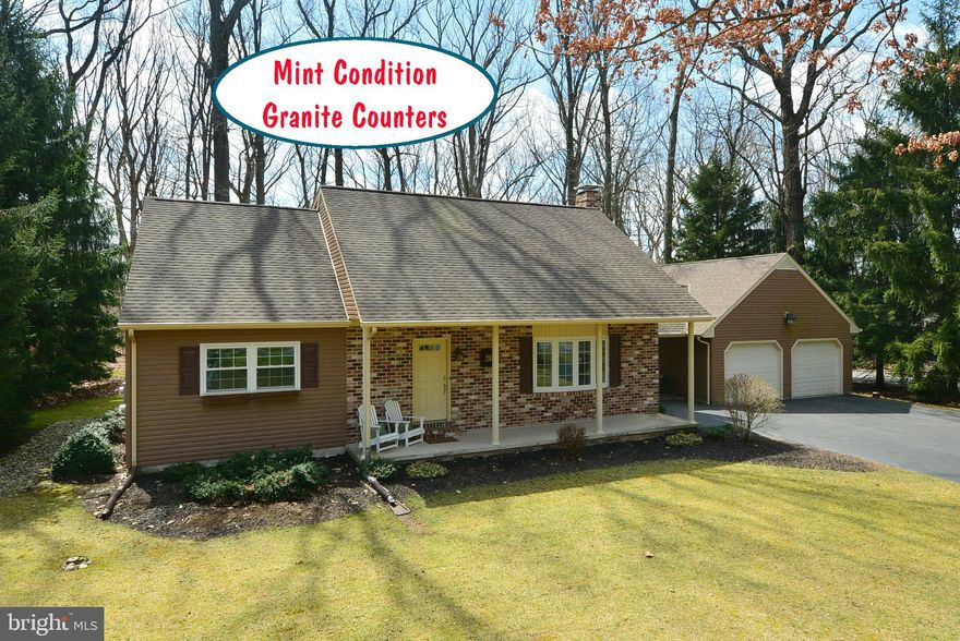 "Cape" in Wooded Setting - Open Floor Plan - Many up Grades - Granite Counters - Ceramic & Wood  Flooring - Pellet Stove - 4 Bedrooms - 2 on Main Level - Brick Breezway to 2  Car Garage - Easy Access to Lake Marburg and Codorus State Park - Easy commute to Maryland