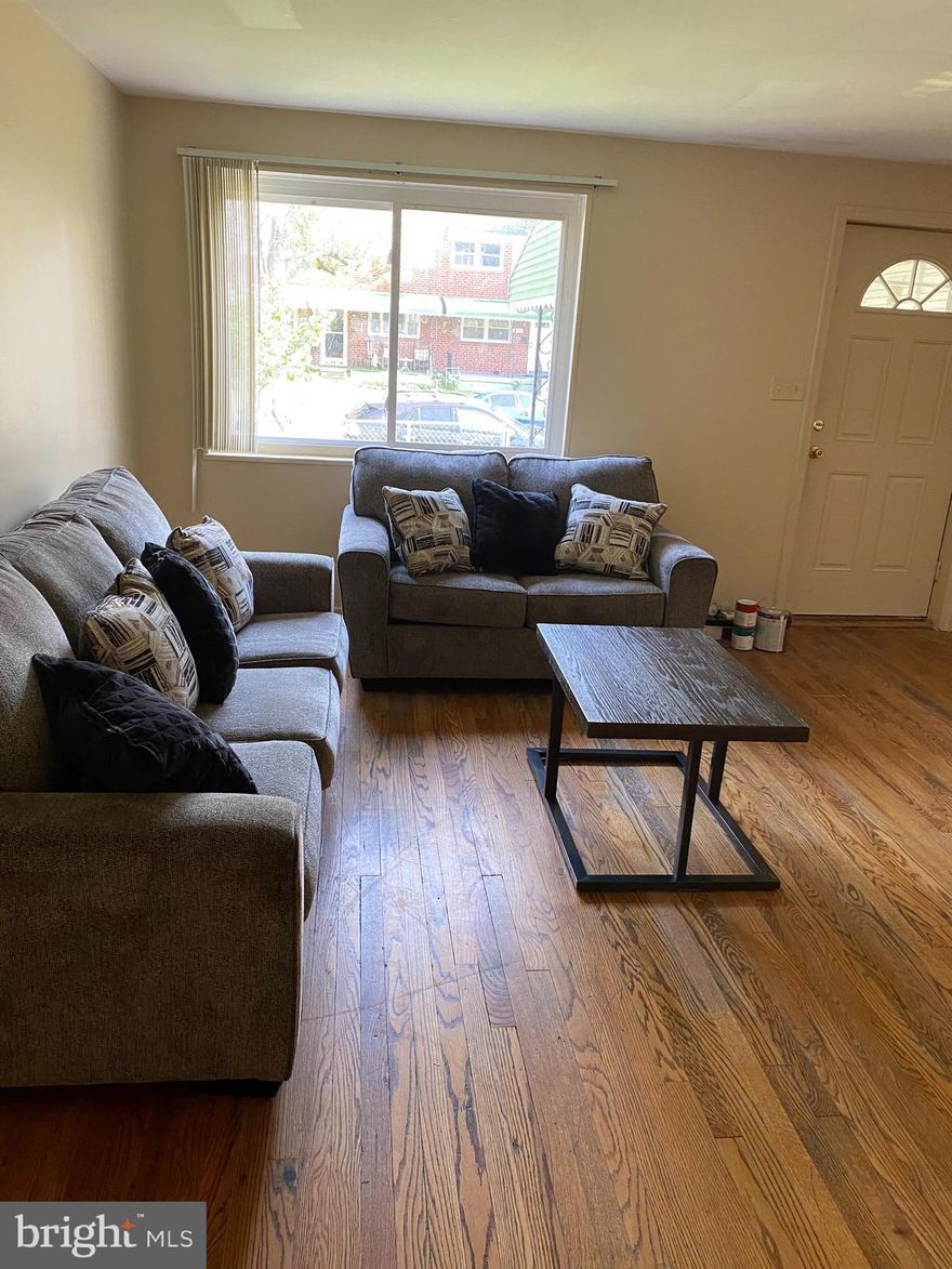 fully rehabbed  townhouse with 4 br 2 bath and finished walk up basement. central air wood floor , ceiling  fans, covered front porch and rear patio. fenced front and back yard. rear parking space
