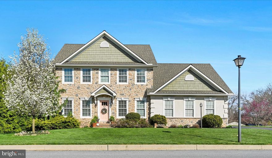 From the moment you pull up to this beautiful stone-front Hickory model by S. Gerald Musser LLC, built in 2018, you can feel it--this is more than a house.....it's a place where everyday moments turn into lasting memories.

Step inside and you're welcomed by 9-foot ceilings and a bright, open feel that makes the home both inviting and functional for busy family life.  The living room quickly becomes everyone's favorite spot, centered around a corner gas stone fireplace-perfect for movie nights, holiday mornings, and cozy evenings together.

The kitchen is truly the heart of the home, where mornings begin and conversations linger.  Featuring quartz countertops, a breakfast bar with pendant lighting, and a pantry with pull-outs, it's designed for everything from quick breakfasts before school to hosting family and friends with ease.  Nearby, the first floor laundry keeps daily routines simple and efficient.

Upstairs is where comfort and connection continue, offering four spacious bedrooms and two full baths-plenty of room for everyone to spread out while still feeling close.  The primary suite is a peaceful retreat at the end of the day, complete with a tray ceiling, barn doors, and a walk-in closet, along with a spa-like bath featuring a double vanity, soaking tub and tiled walk-in shower-your own quiet escape.

Outside the home, you'll appreciate the freedom that comes with no HOA fees-giving you the flexibility to truly make this property your own without added restrictions.

And with a 3-car-side-entry garage, there's room for vehicles, storage, hobbies, and all the extras that come with everyday life.

Homes like this aren't just built--they're lived in, loved, and filled with memories.
Now it's ready for its next chapter.....could that be yours?