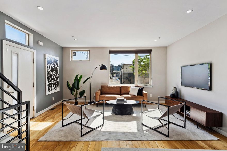 Private Gated 2-Car Parking in Fishtown – Yes, Please! Welcome to 1101 E Berks Street, a spacious corner home in the heart of Fishtown. This modern 3-bedroom, 2.5-bathroom home, complete with a finished basement, offers stunning rooftop views of Center City and is designed for style, comfort, and convenience. Step inside to a bright, open floor plan, perfect for entertaining, with oversized windows that fill the space with natural light. The standout chef's kitchen boasts a large center island, stainless steel appliances, modern shaker cabinets, quartz countertops, and a built-in pantry. On the second floor, you'll find two generously sized bedrooms with large closets, along with a spacious hall bathroom featuring a single sink vanity, a tub/shower combo, and an open shelving nook for extra storage. The entire third floor is dedicated to the oversized primary suite, which includes two closets with custom shelving and a large bathroom with a dual sink vanity and a glass stall shower. As an added bonus, enjoy breathtaking skyline views from your private retreat. For outdoor relaxation or entertaining, head to the roof deck to take in the beautiful city views. The fully finished basement provides even more living space, ideal for a home gym, entertainment area, or office, and includes a laundry room with a utility sink and a powder room. Located in the Adair School Catchment in the vibrant Fishtown neighborhood, this home is just steps from amazing restaurants, coffee shops, fitness centers, and parks. Enjoy the scenic waterfront at Penn Treaty Park or explore the nearby Delaware River trail. With easy access to I-95, 676, Center City, and the airport, this move-in-ready home offers the best of city living with modern amenities. Schedule your showing today!