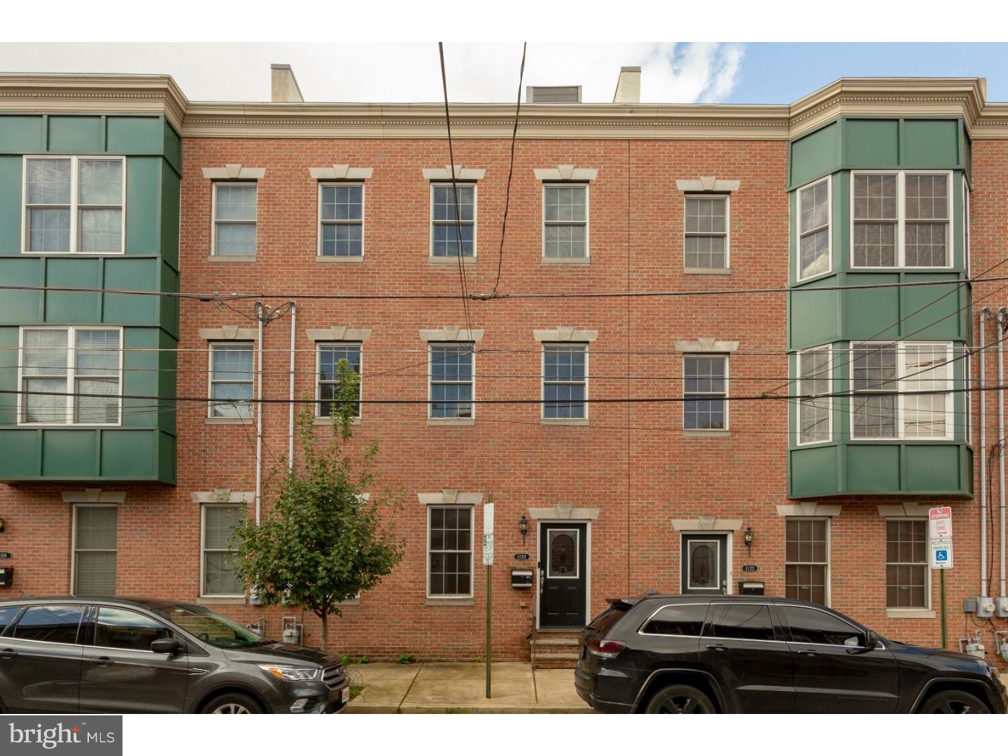 **** Price Drop*****Live large in Fishtown! This amazing townhome is over 2,000 sq. ft with 3 car parking and 3 outdoor spaces. Enter the first-floor foyer from the attached garage, front door or back door where you ll find the entry level bedroom. Second floor features large great room with a bright, spacious kitchen that opens to a deck overlooking the courtyard. This floor has a half bath for convenience. The kitchen has cherry cabinetry, granite counter-tops, and LG SS appliances including a family sized fridge and an oven that's large enough for all your entertaining needs. The 2 private main suites are nestled on the third floor and are complete with walk in closets and en-suite bathrooms. In the master suite you'll find double sinks and a modern, glass, frameless shower. For extra convenience your washer and dryer are located on this floor. It gets even better as you move on to the large roof deck with forever views and plenty of space for home entertaining. If that s not enough, there is an unfinished basement with 9' ceilings for storage or to be finished with your own personal touch. This gated community townhome is 1 1/2 blocks away from Frankford Ave & some of the top-rated restaurants, entertainment spots and amenities in Philly including Suraya, Revolution Bowling, Goose Island Brew House, shows at the Fillmore, Northern Liberties, your very own local Acme and the trolley terminal.