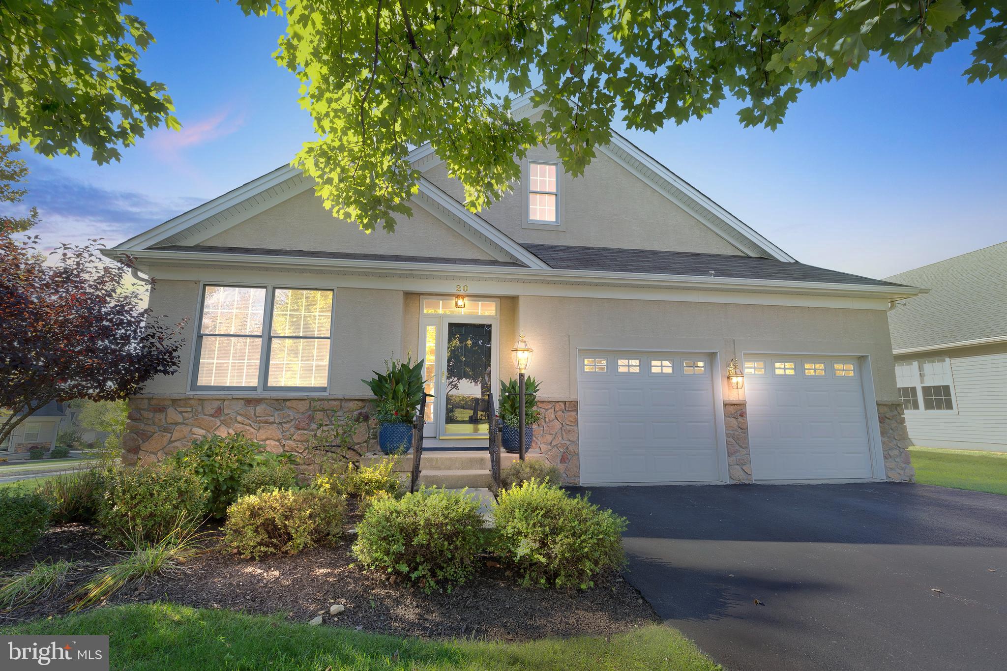 It is not very often that perfection comes along, but HERE IT IS! 20 Ackman Ln is situated on a beautiful corner lot in the Villages at Hillview. This lot provides for beautiful vistas from every window yet once inside provides an element of privacy. Arriving at the property the seller has planted lush gardens full of perennials providing maintenance free enjoyment with an assortment of hydrangeas, rose of Sharon, roses, lilies, lavender, coreopsis, azaleas and more.  The front entry way features a custom railing & lamp post with dusk to dawn timer to greet you. Entering this home, you immediately are struck by a sense of class and comfort. Immediately off the main foyer French doors lead you in the to quaint office/den. Beyond the office your enter the stunning dining room with hardwood floors that go throughout the main level, large sun drenched windows, and tray ceiling with recessed lighting. Entering the rear of the home is where you immediately stop and feeling completely at home. The gorgeous kitchen with breakfast area opens to the inviting family room centered on the marble surround gas fireplace. This area is perfect for everyday living and phenomenal entertaining. The kitchen features stainless steel appliances, double wall oven, upgraded granite countertops, and large island. The family room features a vaulted ceiling fan, hardwood flooring, recessed lighting, and beautiful new ceiling fan. Right off the family room is a beautiful sunroom with sliders to the Trex deck, perfect for enjoying cocktails while watching the sunsets. Abutting the living area is a sumptuous master suite with lots of natural light, a fantastic walk-in closet, and ensuite master bath with dual vanity, whirlpool tub, and stall shower. Rounding out the main level is a guest bedroom large enough to hold a king size bed, 3-piece hall bath, mud/laundry room, and access to the pristine 2 car garage. Upstairs you find another loft/rec room, large walk-in storage closet, 3-piece bath and 2nd guest room. The basement is unfinished but has potential for an enormous amount of storage or future finishing as it was built with an egress window. Recent upgrades include hardwood flooring throughout (2019), fresh paint (2019), Lennox HVAC (2017 and still under warranty), Water heater (2017), and upgraded electrical panel with whole house surge protector. Not to mention lifestyle that living at Hillview provides with access the 5 clubhouses, pools, game rooms, tennis courts etc. all in a stone’s throw from the residence. This home is truly a showstopper and you will not be disappointed in the least!