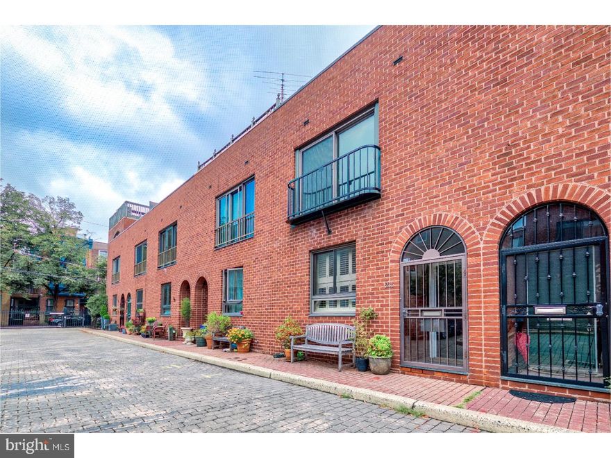 Exceptional Headhouse Court townhome with DEEDED PARKING!  Premier Queen Village location in private, gated courtyard just off rarely-trafficked American Street in the Meredith Elementary catchment.  First floor: custom kitchen with shaker-style maple cabinetry, natural stone counters, stainless steel appliances and glass back-splash. Kitchen opens to formal dining room and oversized living room with floor-to-ceiling built-ins surrounding wood burning fireplace.  1/2 bath, and slider to private bricked PATIO/GARDEN with walled planter.  Straight-through space offers true great room feeling. Hardwood flooring, recessed lighting, and substantial/detailed moldings throughout.  2nd floor master suite with juliet balcony, hallway laundry (side-by-side), and additional bedroom.  3rd floor with two well-proportioned bedrooms, newer hall bath, and South facing terrace spanning entire width of the home.  Full, finished basement with 8' ceilings ideally suited to be playroom, media room and/or home gym.  North/South exposure allows for extraordinary natural light throughout the day. 99 Walk score...Close proximity to premier shopping, restaurants, parks, public transport, and cultural destinations.