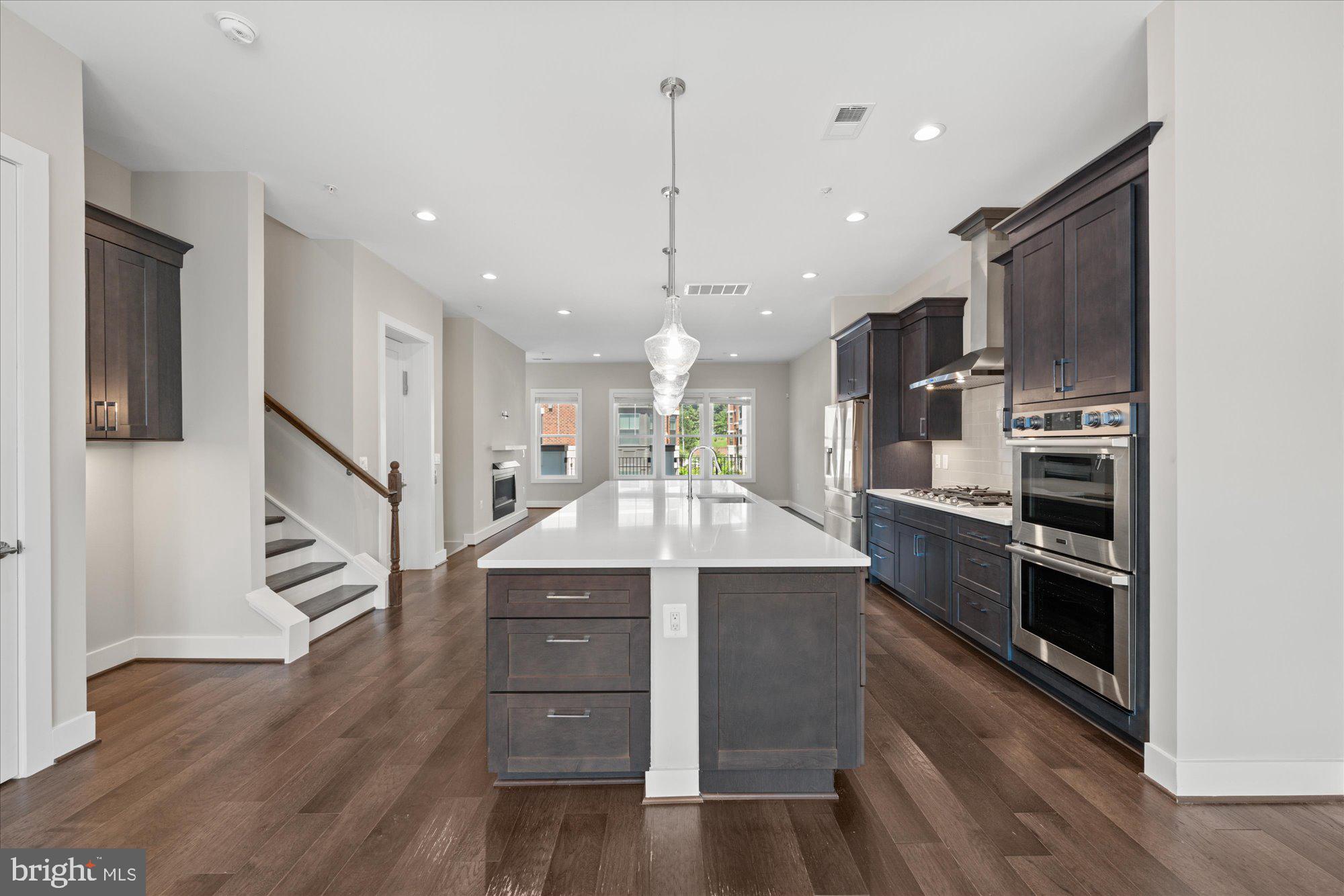 Elegant 4-Bedroom Townhome in the heart of Vienna, VA – Steps from Church Street’s Boutique Charm.
Discover sophisticated living in this stunning 4-bedroom, 3.5-bathroom townhouse ideally located near the quaint shops and eateries of Vienna’s historic Church Street. Built in 2022, with almost 4,000 sq ft of indoor and outdoor space, this residence blends timeless curb appeal with modern luxury, featuring a striking brick and Hardie Plank exterior and upscale interior finishes throughout.
Step inside to soaring 10’ ceilings on the main level, 5” engineered hardwood flooring, and abundant recessed and designer pendant lighting. The gourmet kitchen is a chef’s dream, offering Dacor stainless steel appliances, a French door refrigerator, 36” cooktop with chimney-style vent hood, below counter oven/microwave combo, 42” soft-close painted maple cabinetry with pull-out trays, granite countertops, an undermount sink, and a large island perfect for entertaining.
Retreat to spa-inspired bathrooms adorned with granite vanity tops, maple painted vanities, and ceramic tile floors with full-height shower surrounds. Two outdoor living spaces, a cozy fireplace, and an elevator with access to all levels that further enhances the comfort and convenience of this home.
Additional highlights include:
Rear-load two-car garage with insulated, drywalled, and painted walls.
Dual-zone heating and cooling with Carrier high-efficiency gas furnaces.
Whole-house fresh air ventilation system & programmable thermostats.
Two versatile living areas ideal for work or relaxation.
Perfectly positioned in a sought-after Vienna neighborhood, this residence offers refined living within walking distance of boutique shopping, cafes, and community events—truly the best of small-town charm and modern convenience.